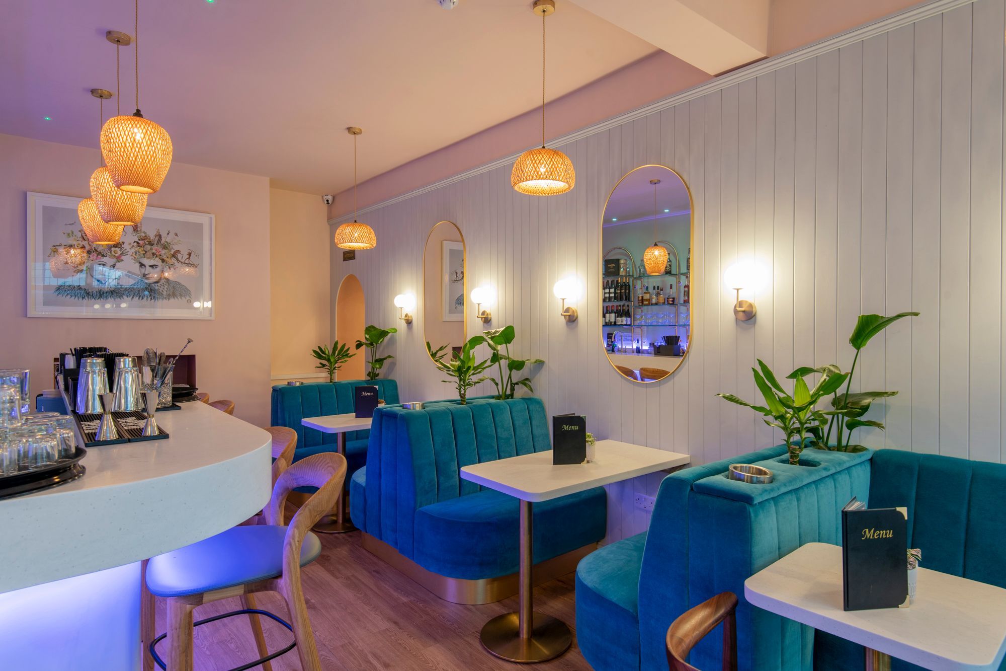 inside the 2 Church Street, tiffany blue diners and bar chairs, white table, mirrors on the wall