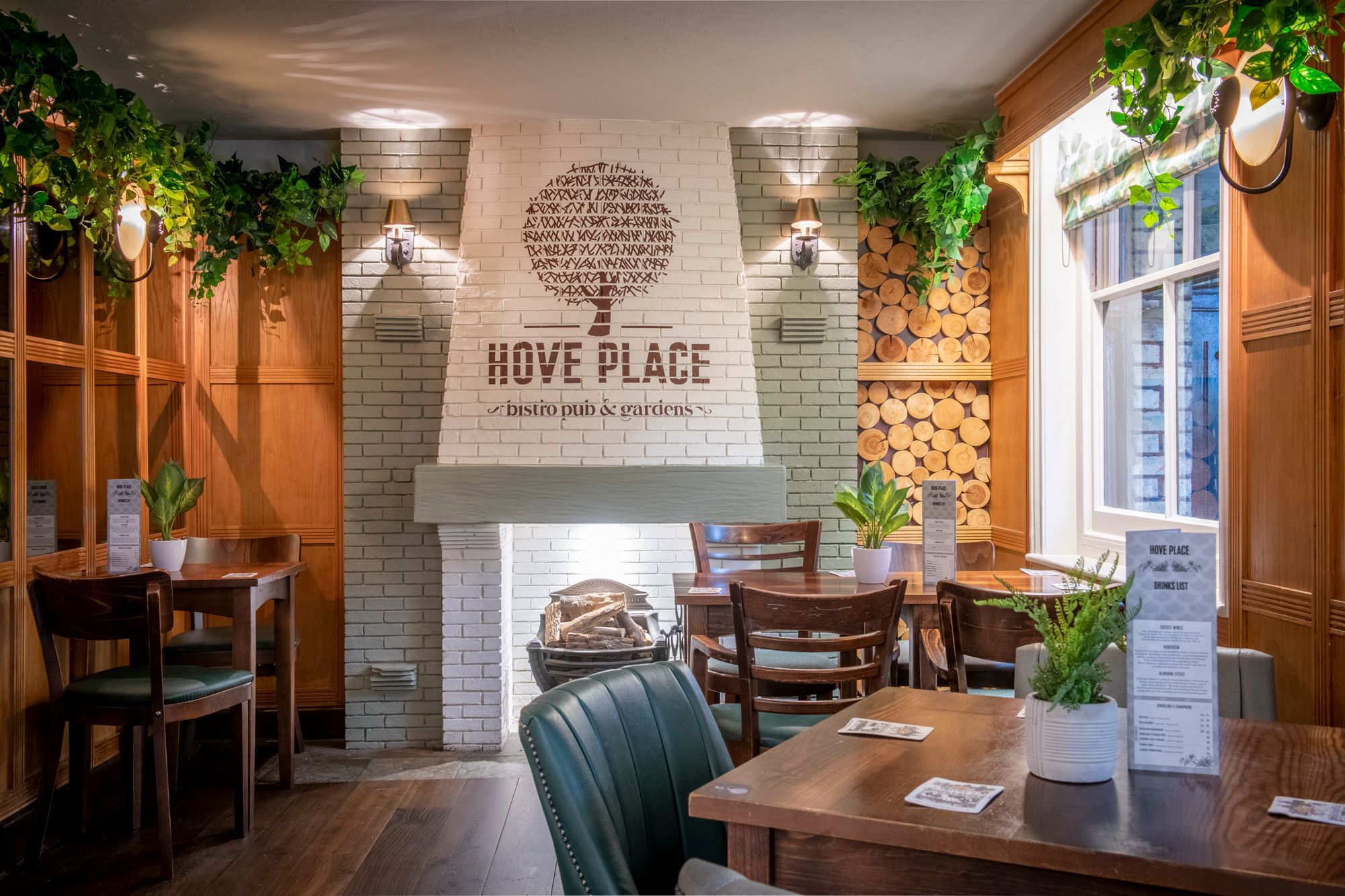 fire place made of white colored brickes with hove place logo