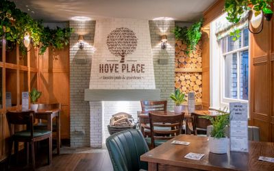 fire place made of white colored brickes with hove place logo