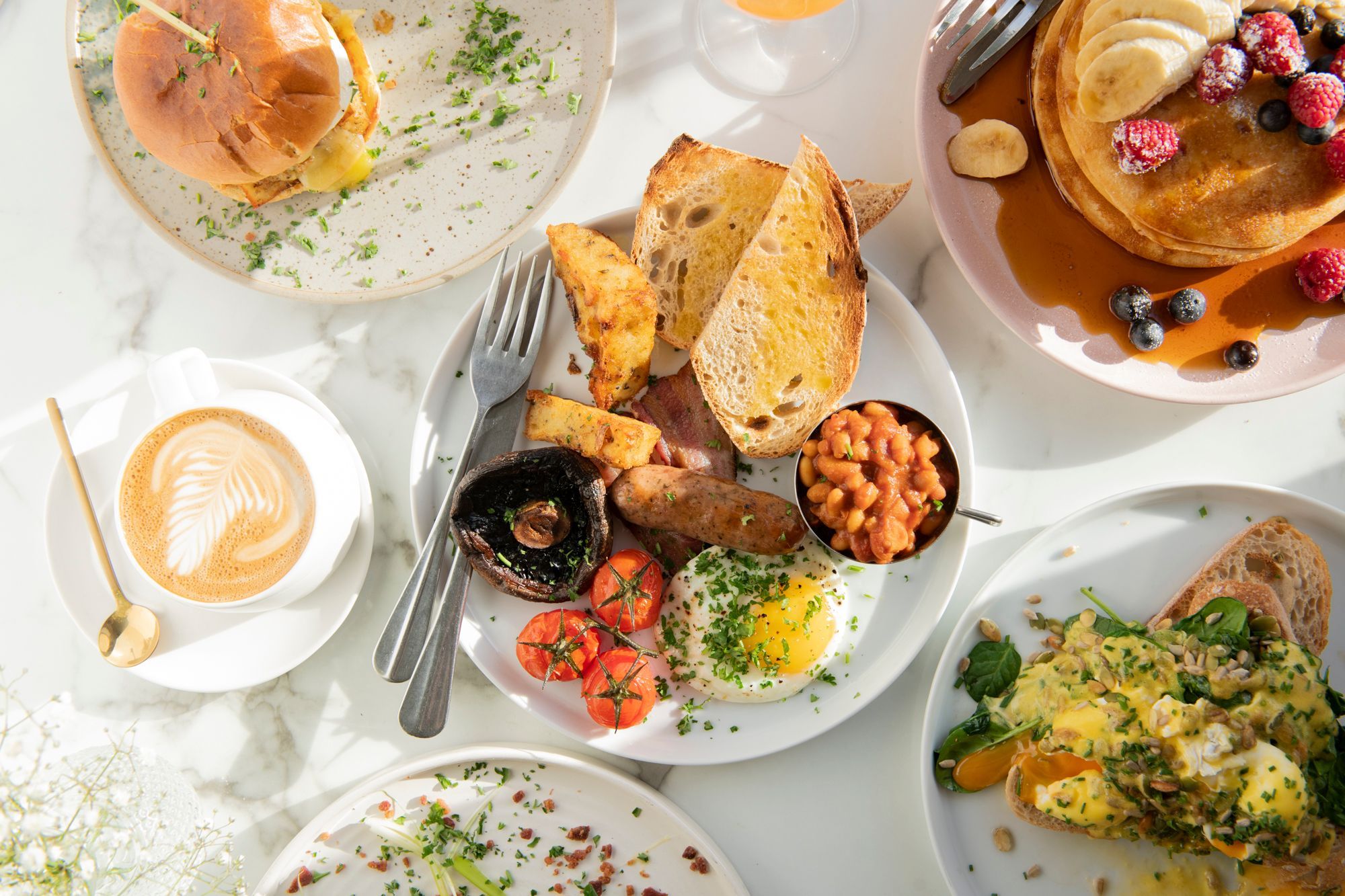 over head shot of the table laid out with coffee, cocktails and brunch dishes