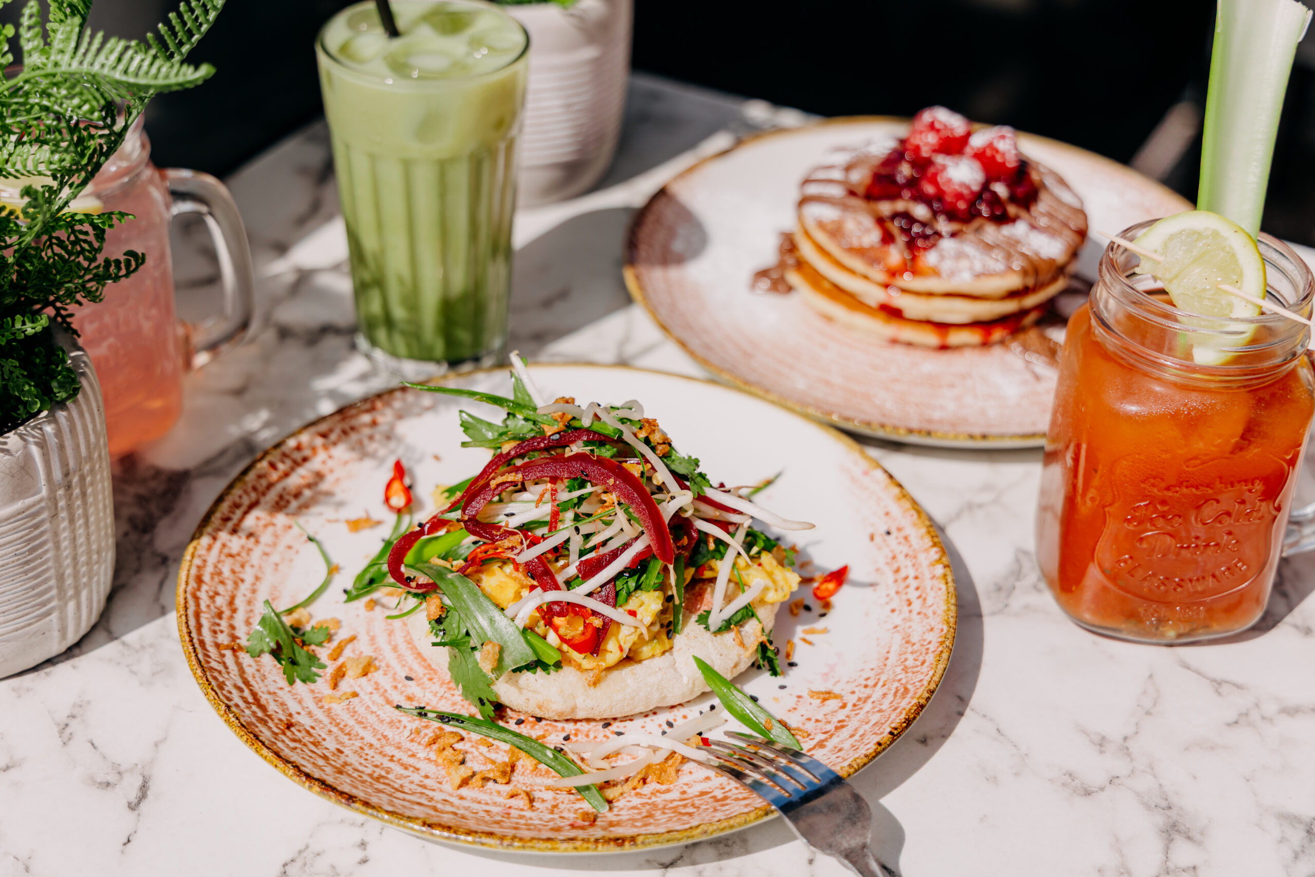breakfast dishes served with smoothies at baked hove