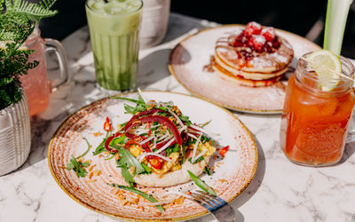 breakfast dishes served with smoothies at baked hove