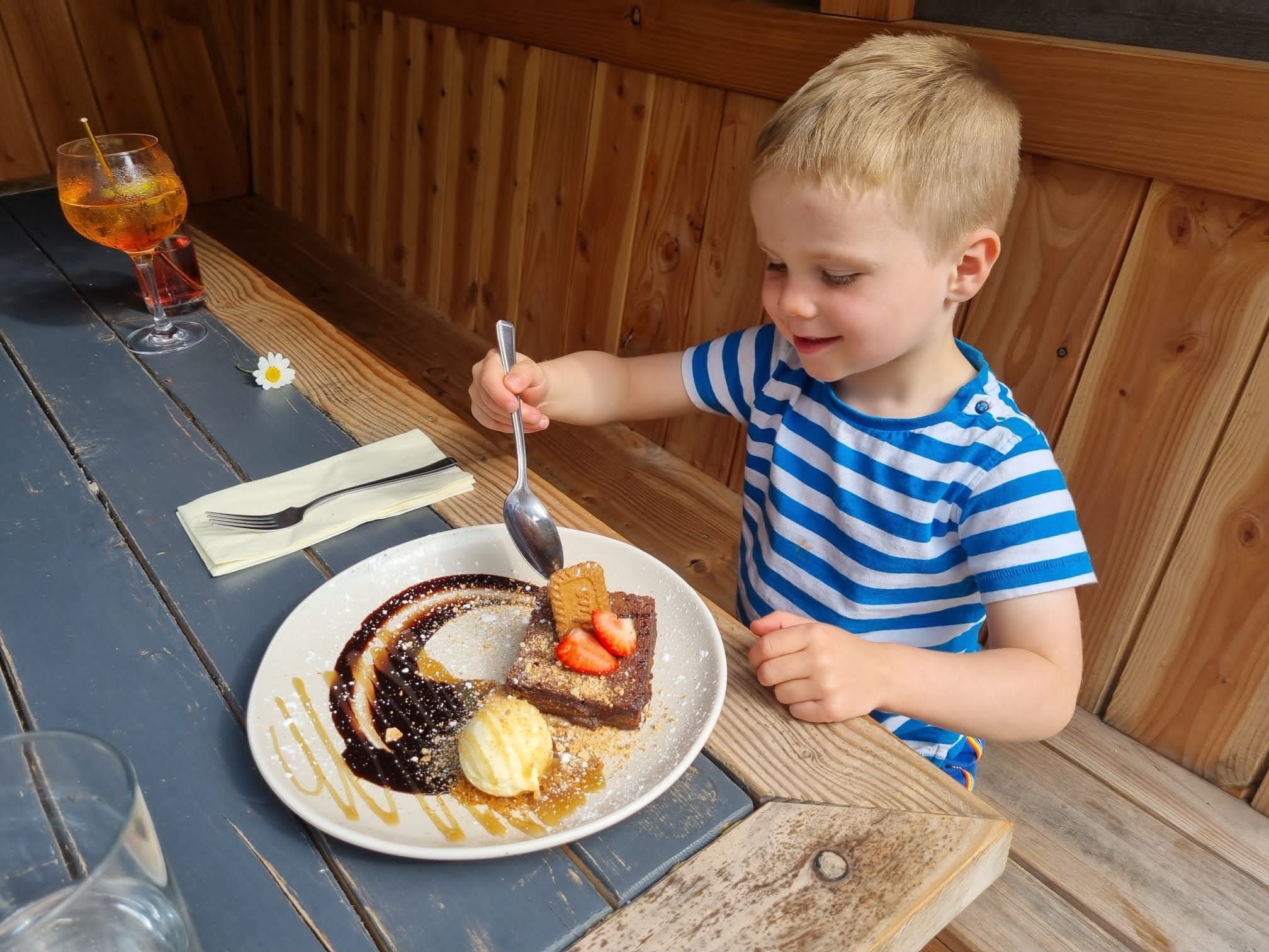 kid Liam enjoying Warm Biscoff Chocolate Brownie when on a family day out at Ladies Mile