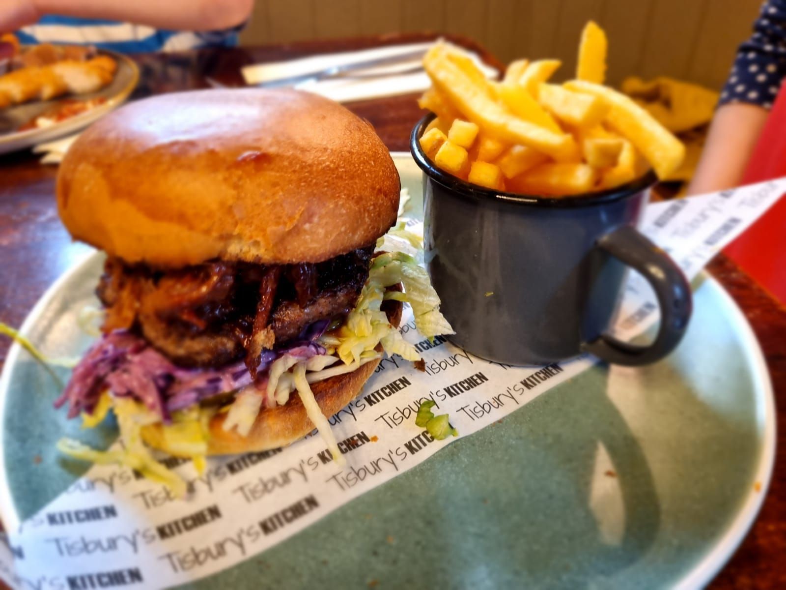 juicy all beef patty topped with succulent pulled pork, pickles, coleslaw, and crispy onion flakes