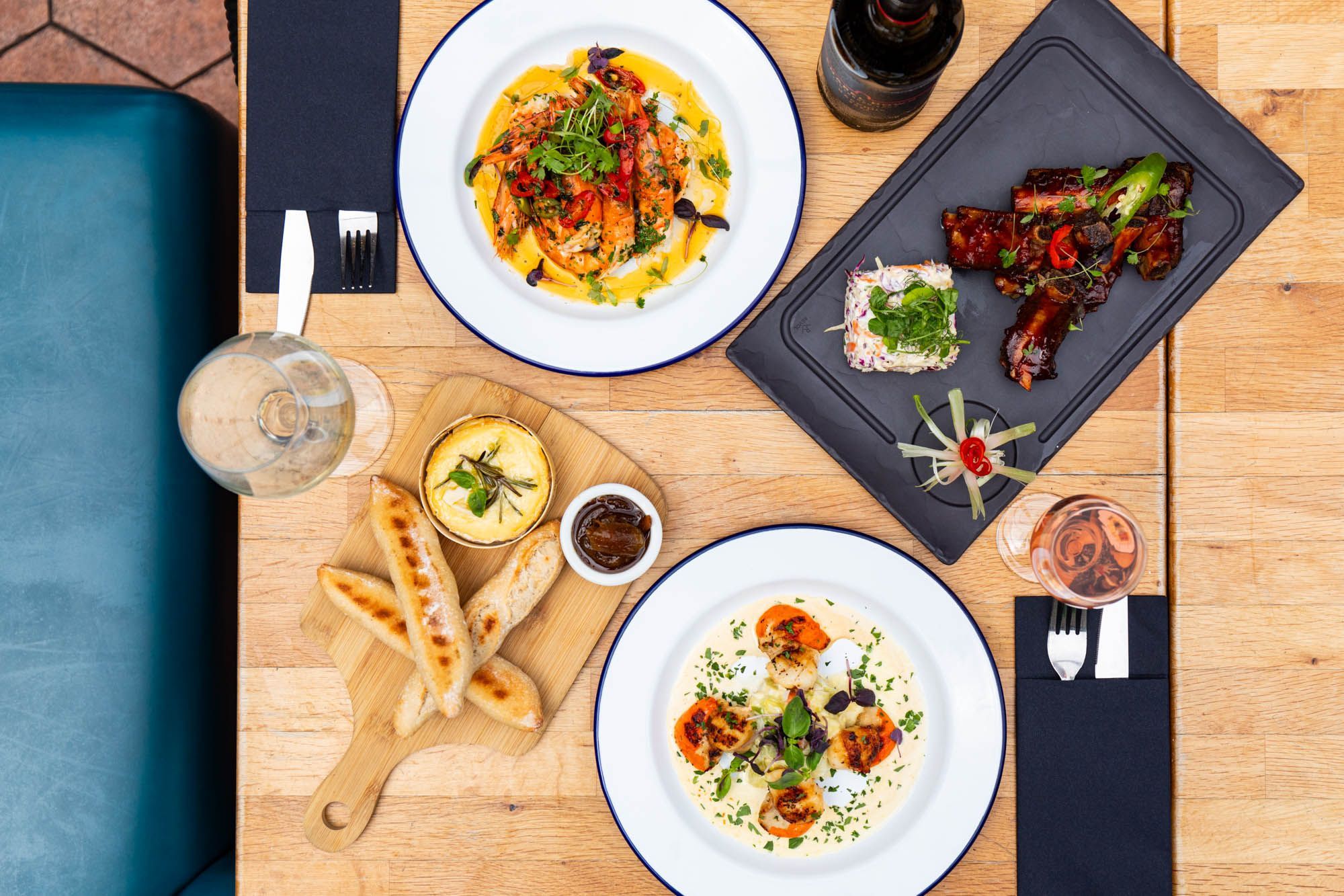 over head shot of the food at the Paris Wine Bar - wine served in glasses