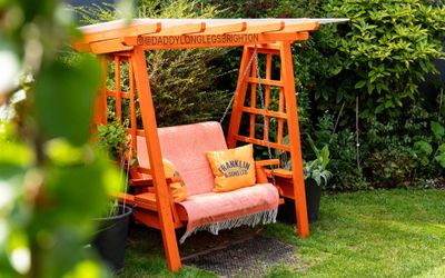 comfy orange coloured garden swing at DaddyLonglegs
