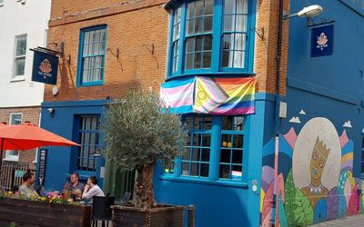 Bars Brighton Guide LGBTQ+ The Actors. A blue building displaying the Pride flag