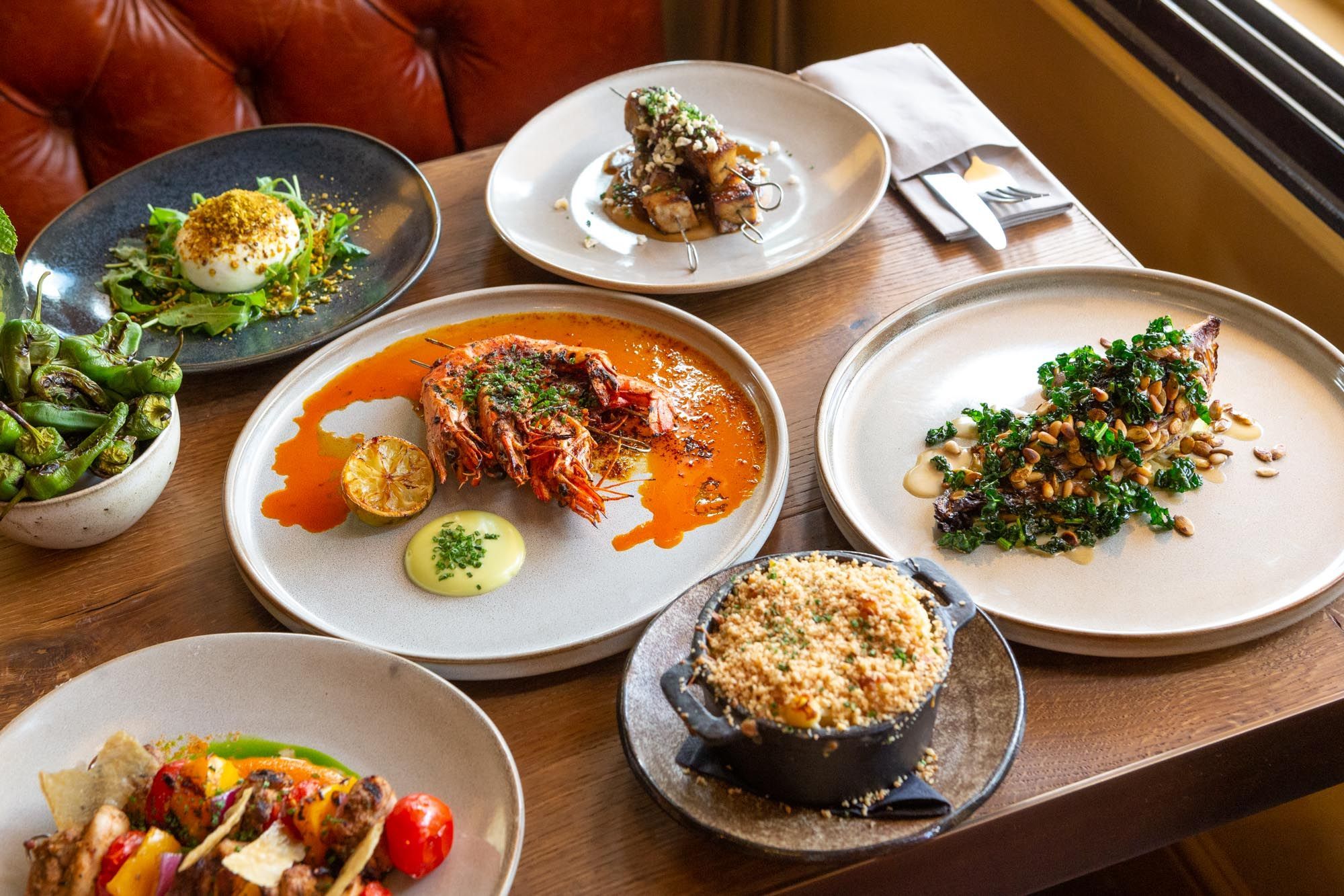 side shot of six dishes served on the table of third avenue