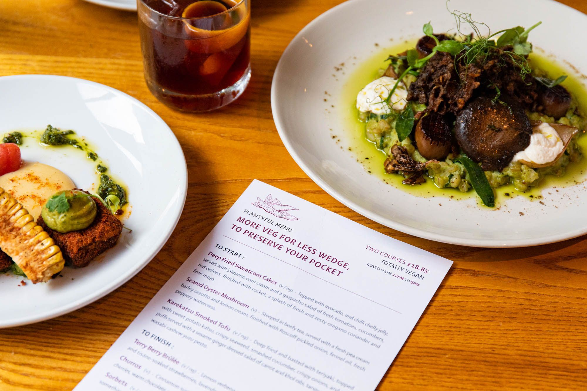 over head shot of the Terre a Terre menu on the table, two dishes on served on the side