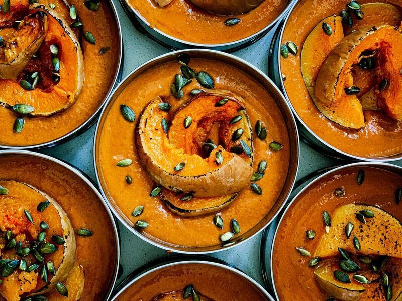 over head shot of the Majahma pumpkin dish served in tiffin. Five  reasons to try Majahma