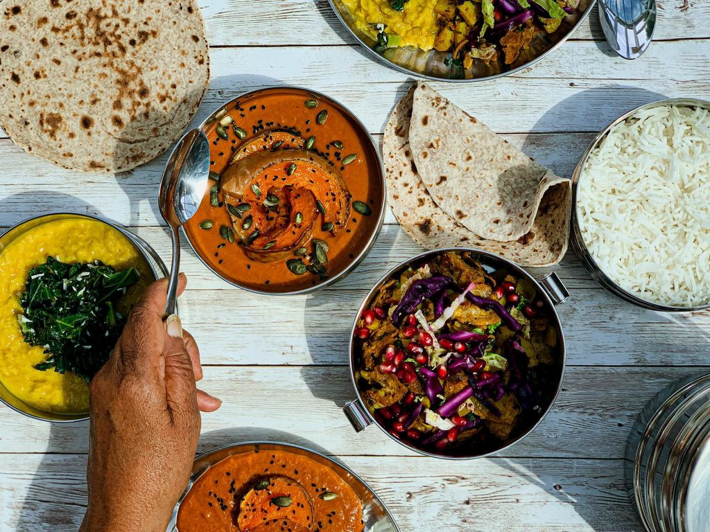 over head shot of the table laid out with Majahma delivery dishes