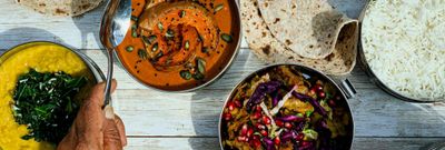 over head shot of the table laid out with Majahma delivery dishes