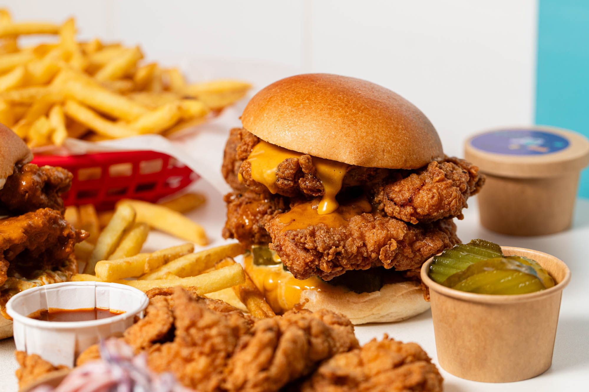 Lost Boys Land fried chicken burger looking delicious. Served with their sauces and chips and pickles