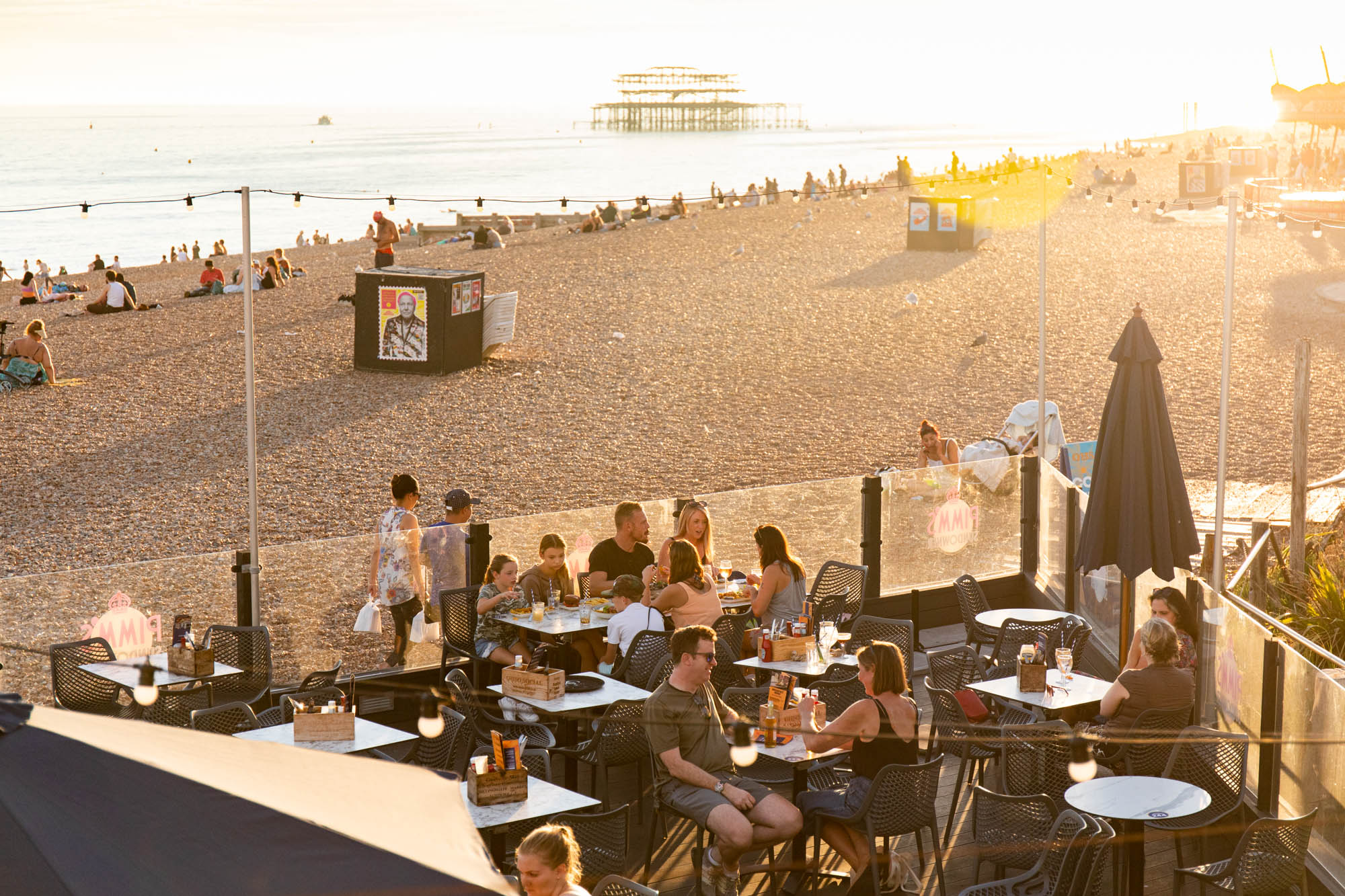 sunset shot of the ohsos outdoor terrace and Brighton beach. Coronation 2023 events here.