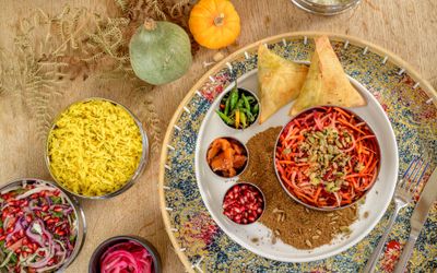colourful over head shot of the plate with Indian dishes