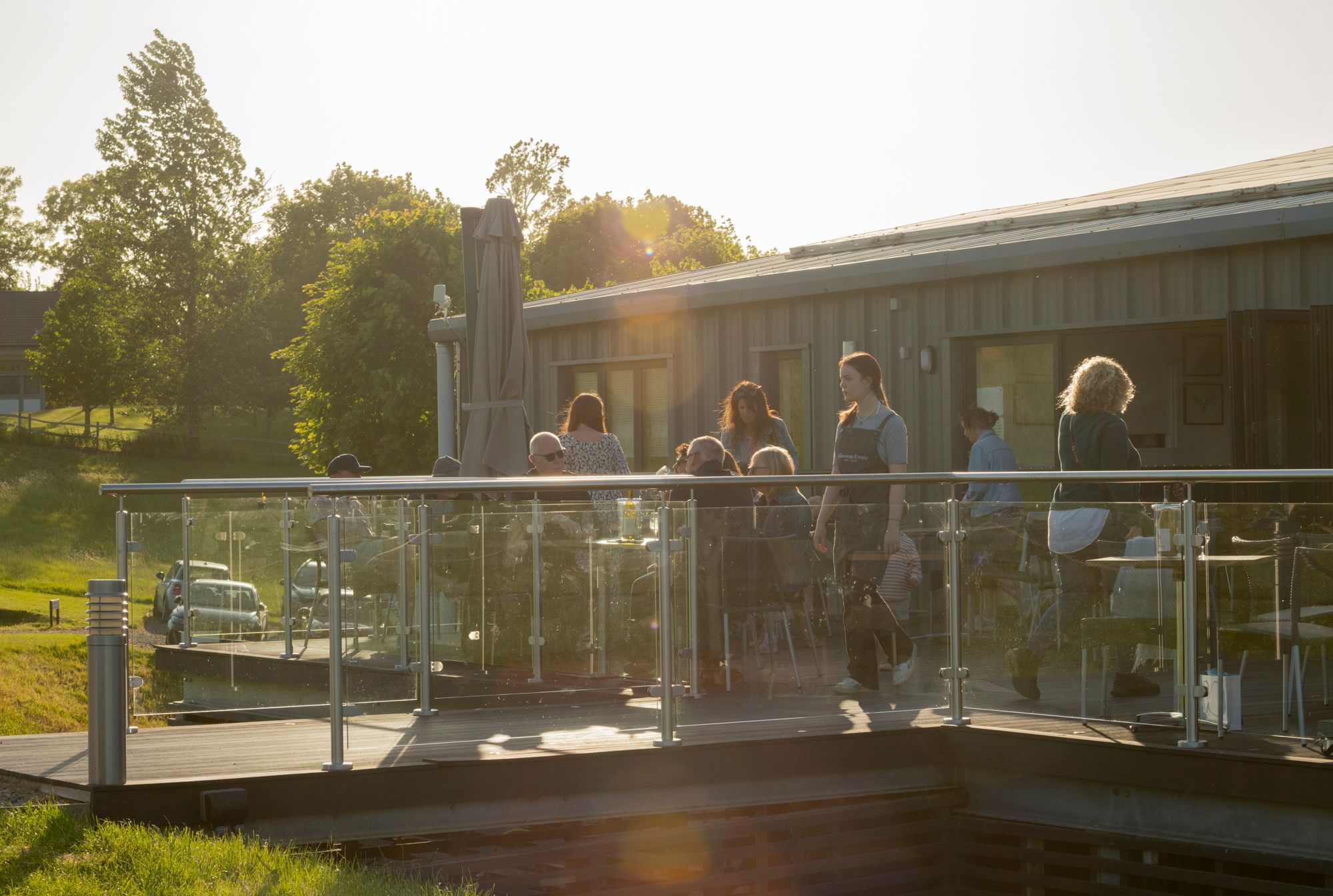 distance shoot of Albourne Estate terrace with people sitting