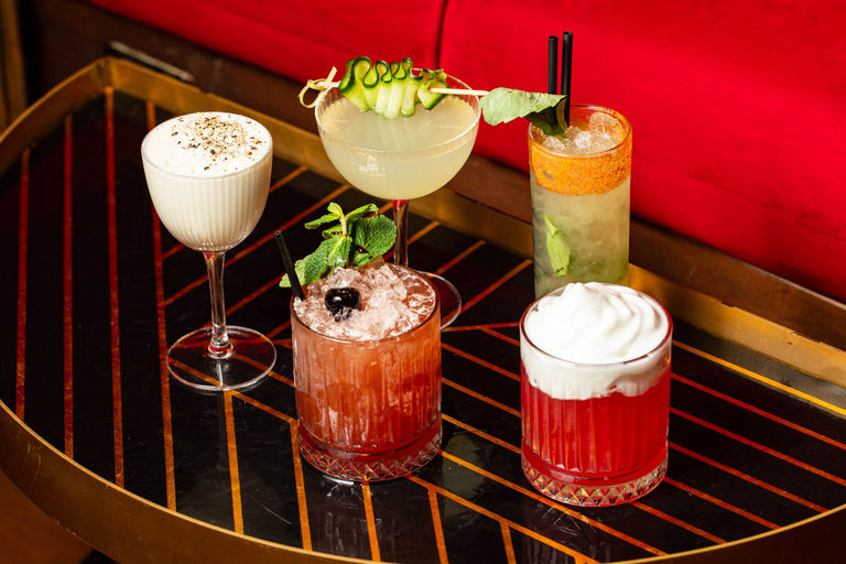 five different cocktails on the table at Bar Valentino
