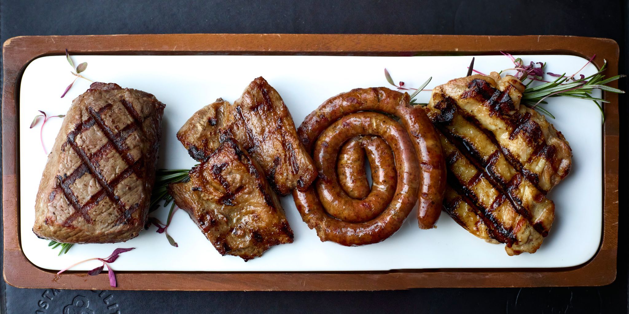 white plate with different types of meat - Latinoamérica Hove