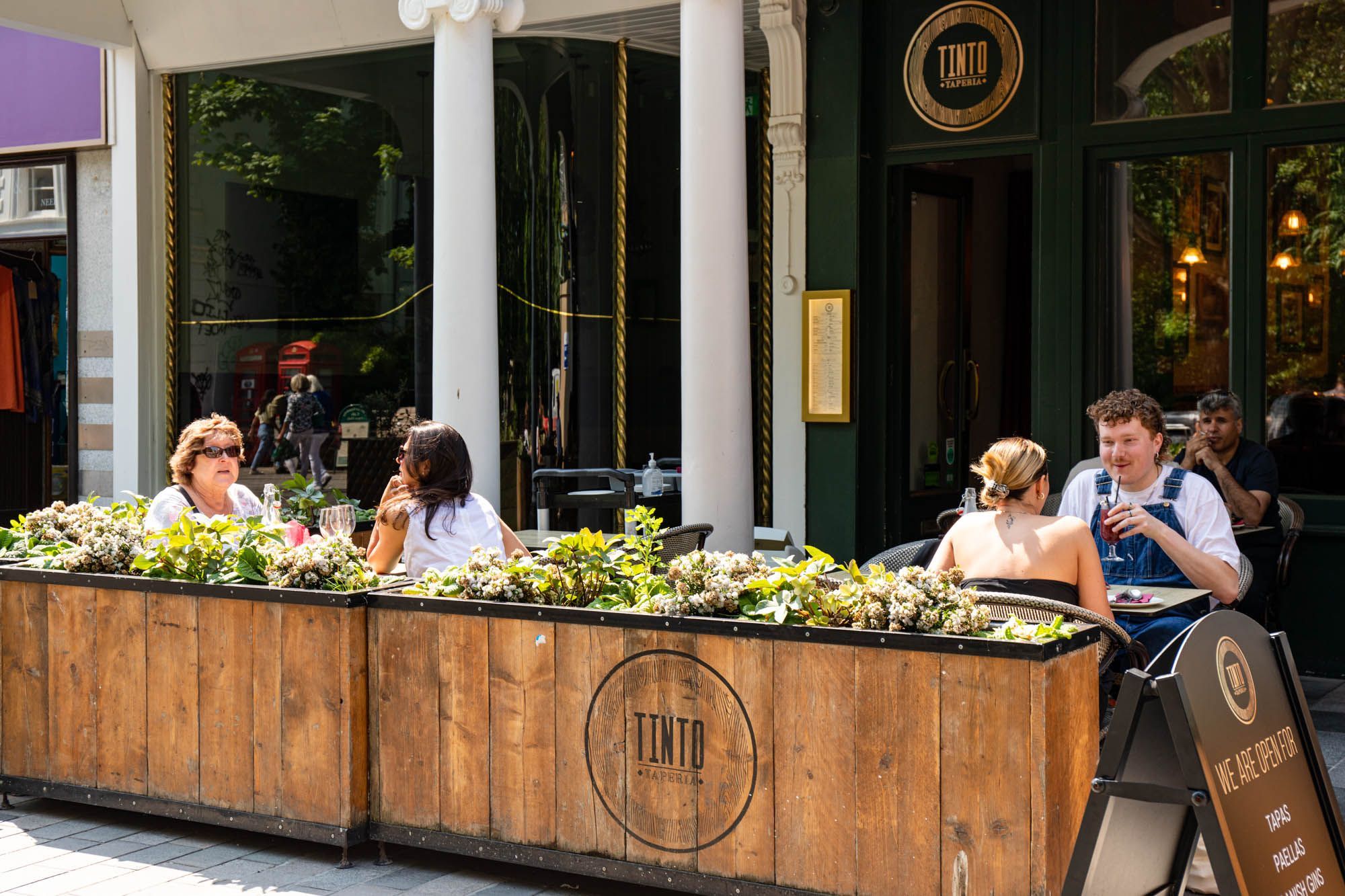 close up shot of people sitting in front of Tinto Taperia 