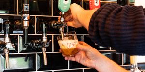Half of pint being poured on beer tap at the Cider Tap Sussex