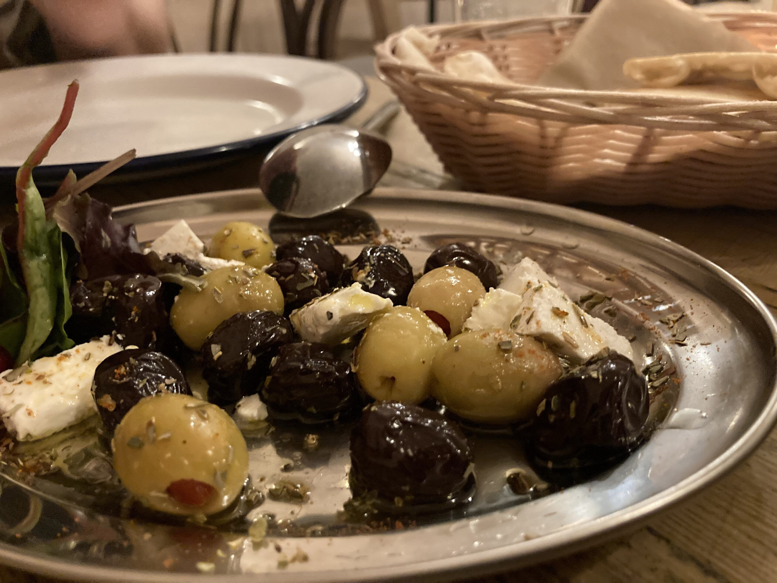 a selection of pimento-stuffed green olives, black olives and a silky feta cheese