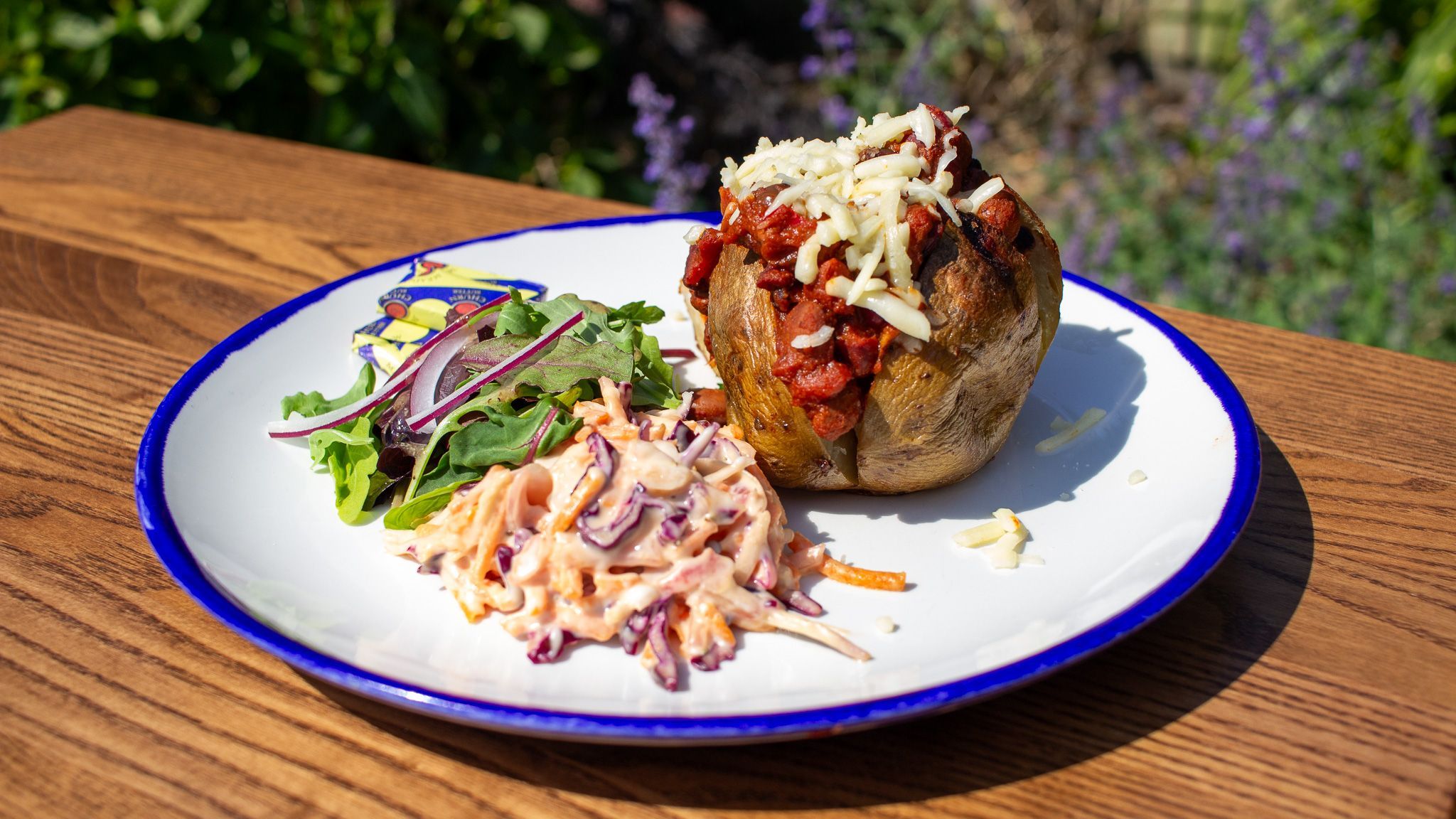 dish served on the white plate with blue edges at The Cricketers Worthing garden