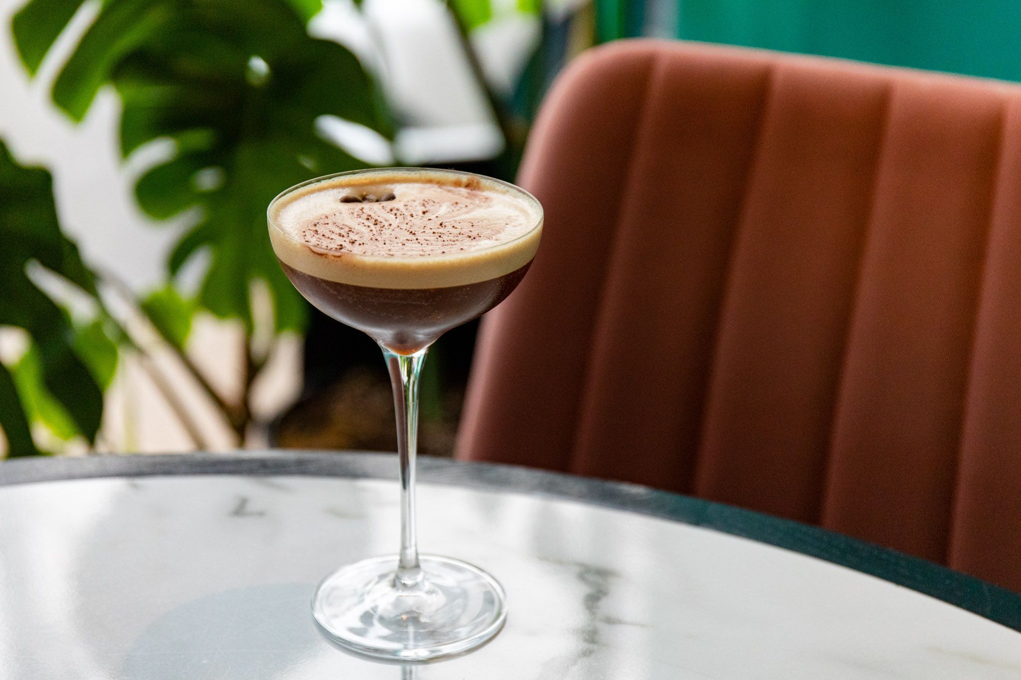 espresso martini cocktail on the marble table