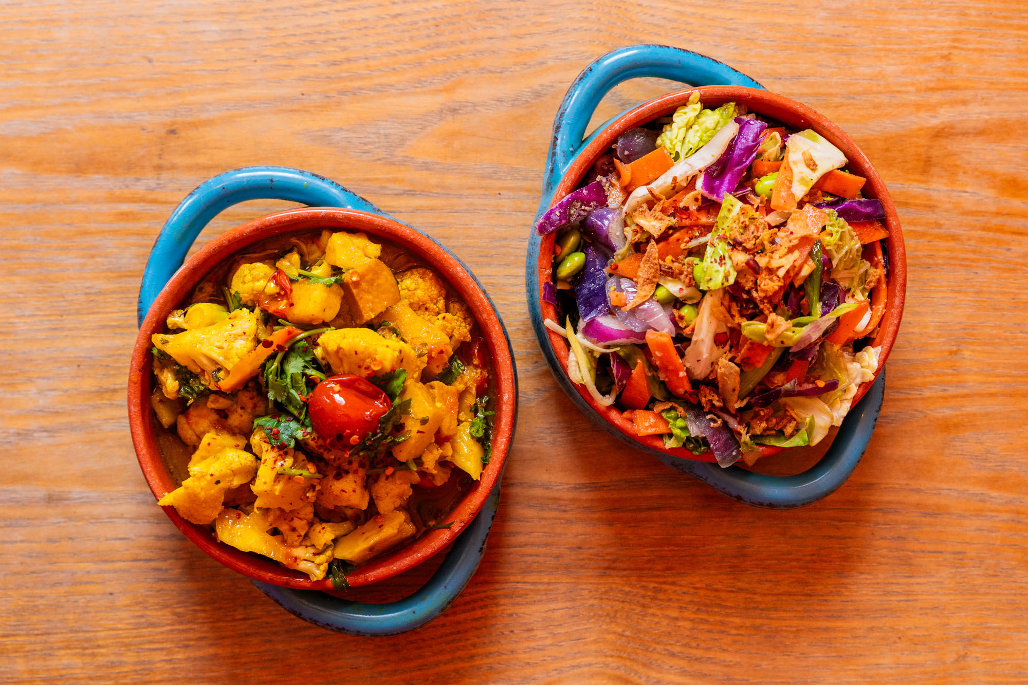 two blue bowls with the dishes
