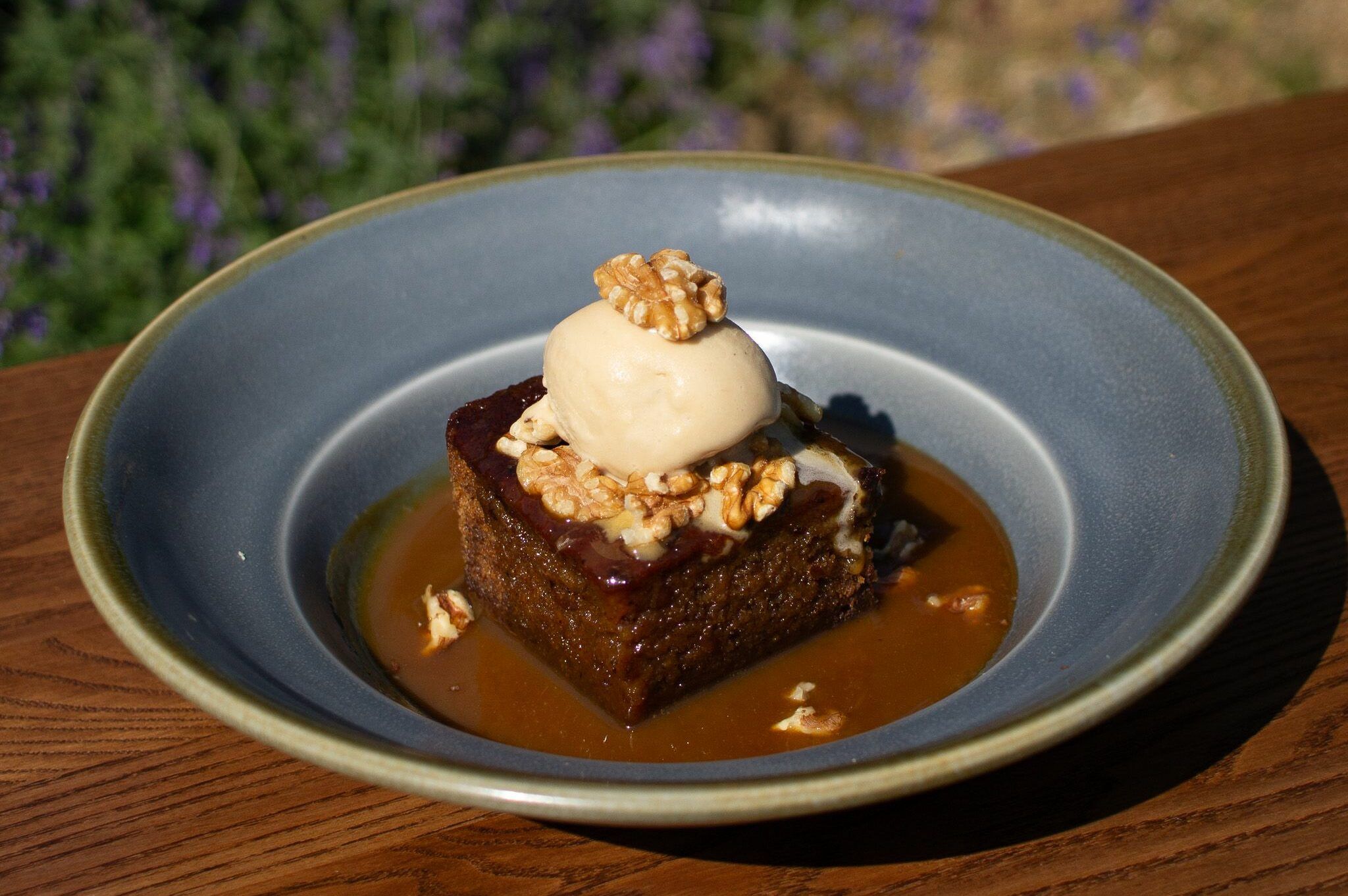 chocolate brownie with ice cream served in gray plate at The Cricketers Worthing