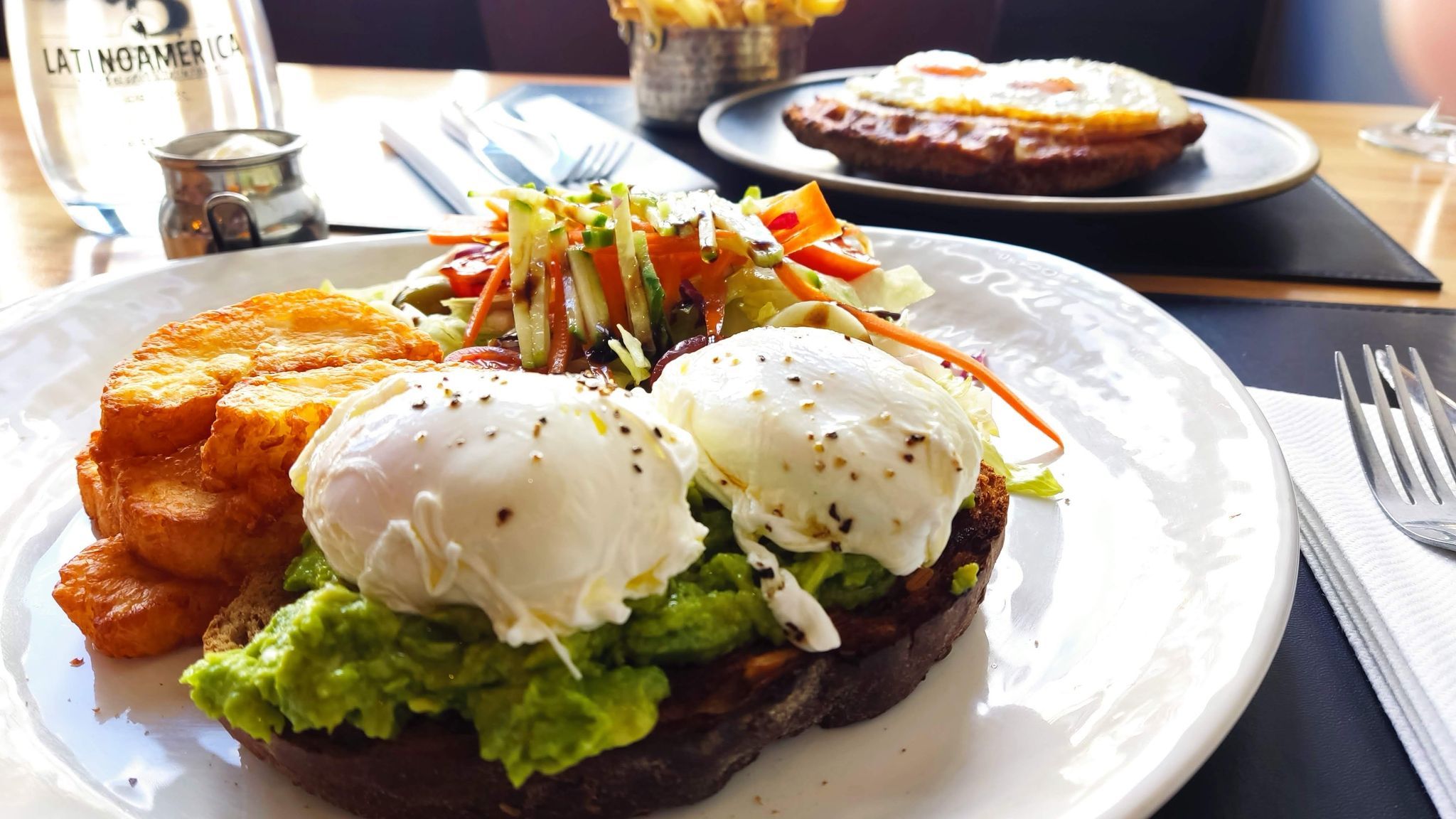 avocado on toast, topped with a beautifully gooey poached egg as a part of brunch feast menu at LatinoAmerica