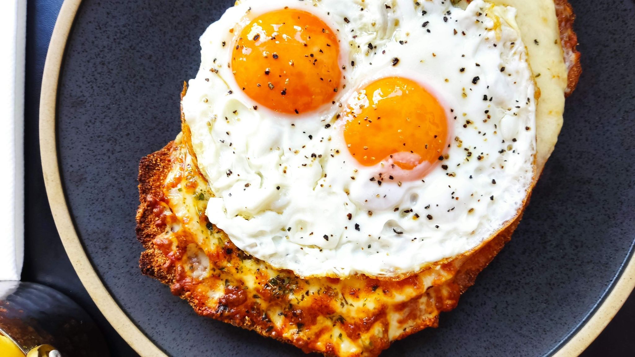 over head shot of the two poached eggs on halloumi cheese as a part of the brunch feast menu at LatinoAmerica