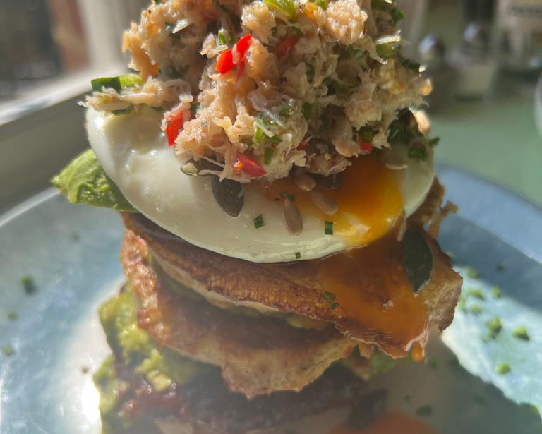 A frumpet stack for an Oeuf experience topped with crab,