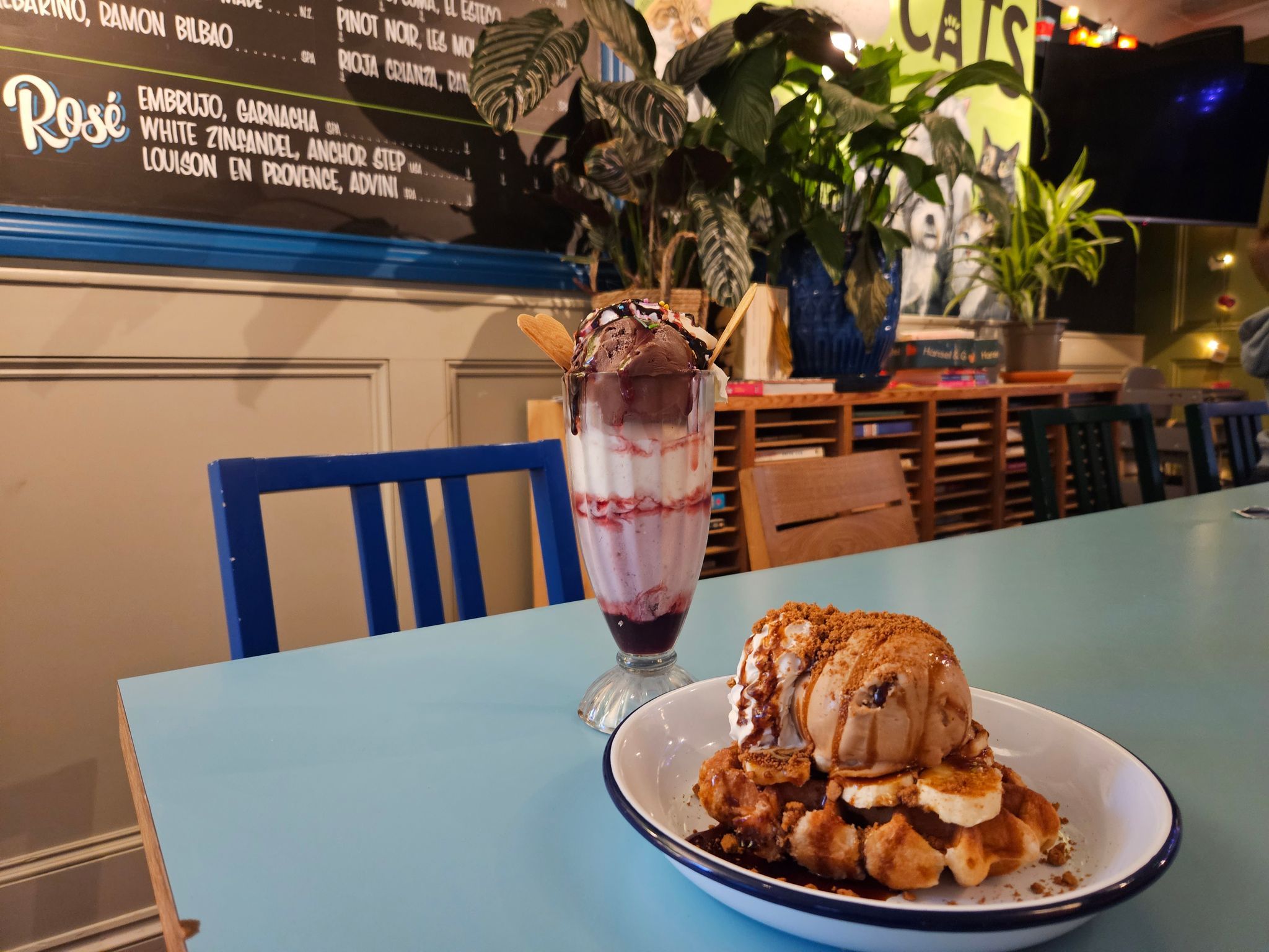 Neapolitan Sundae and Ice cream waffle on the light blue table served as a dessert for the family dinner at The Lewes Road Inn