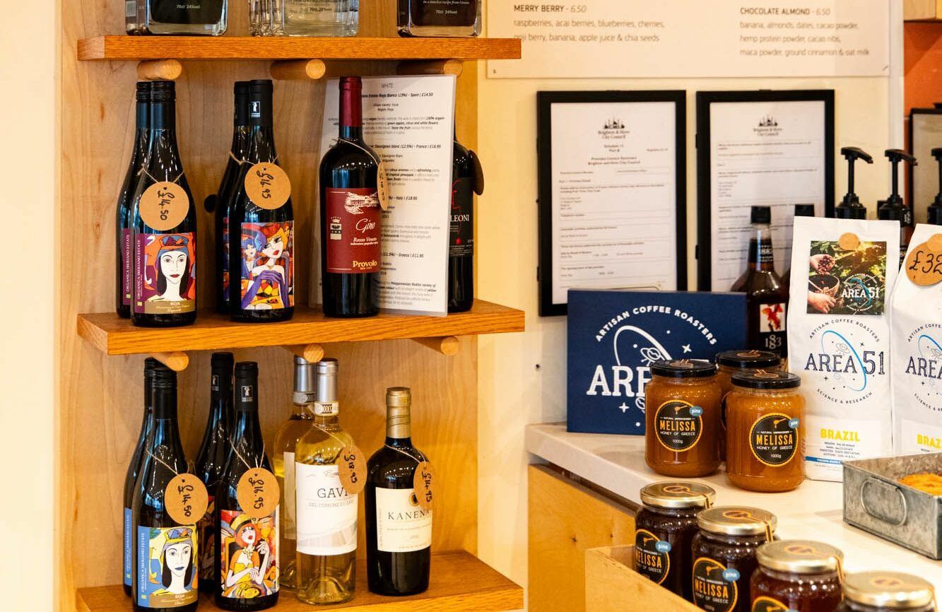 shot of the shelves at Vios Brighton showcasing various Greek drinks including wine