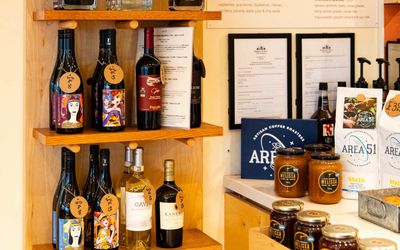 shot of the shelves at Vios Brighton showcasing various Greek drinks including wine