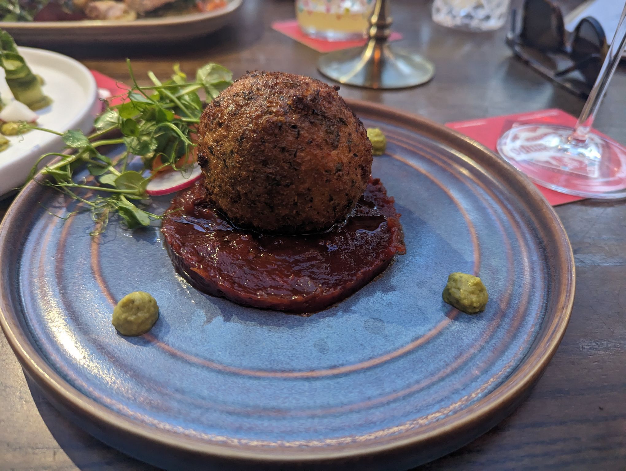 Truffled Cauli Bon Bon served on the blue plate. New dish on the spring menu