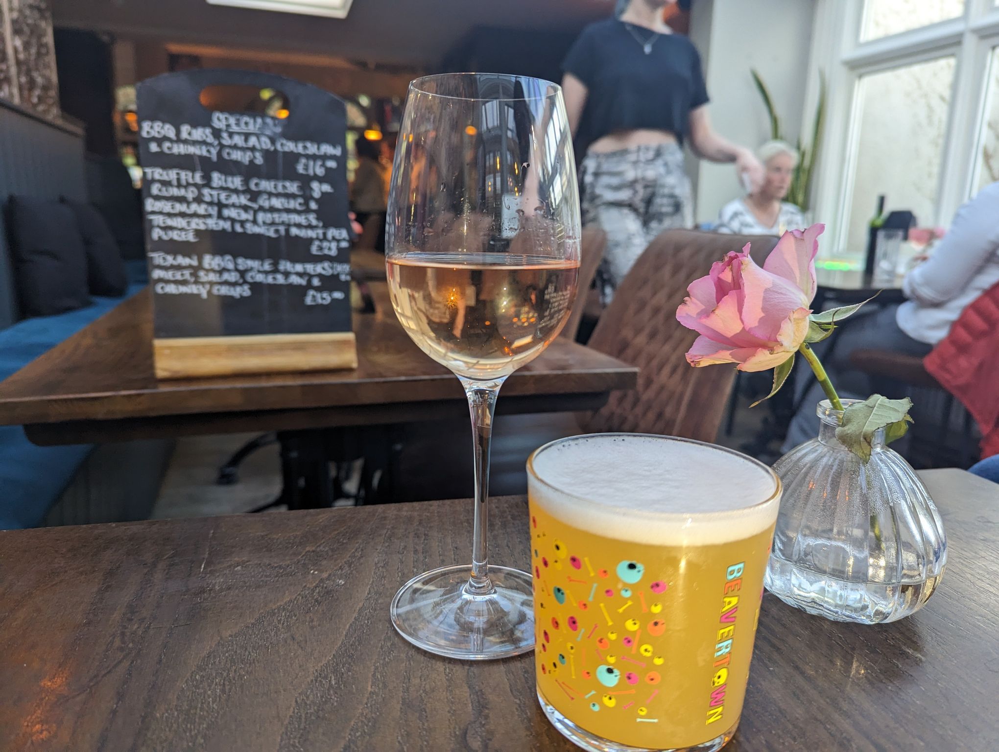 glas of wine and pint on the wooden table at the Cleveland Arms. Spring menu launch