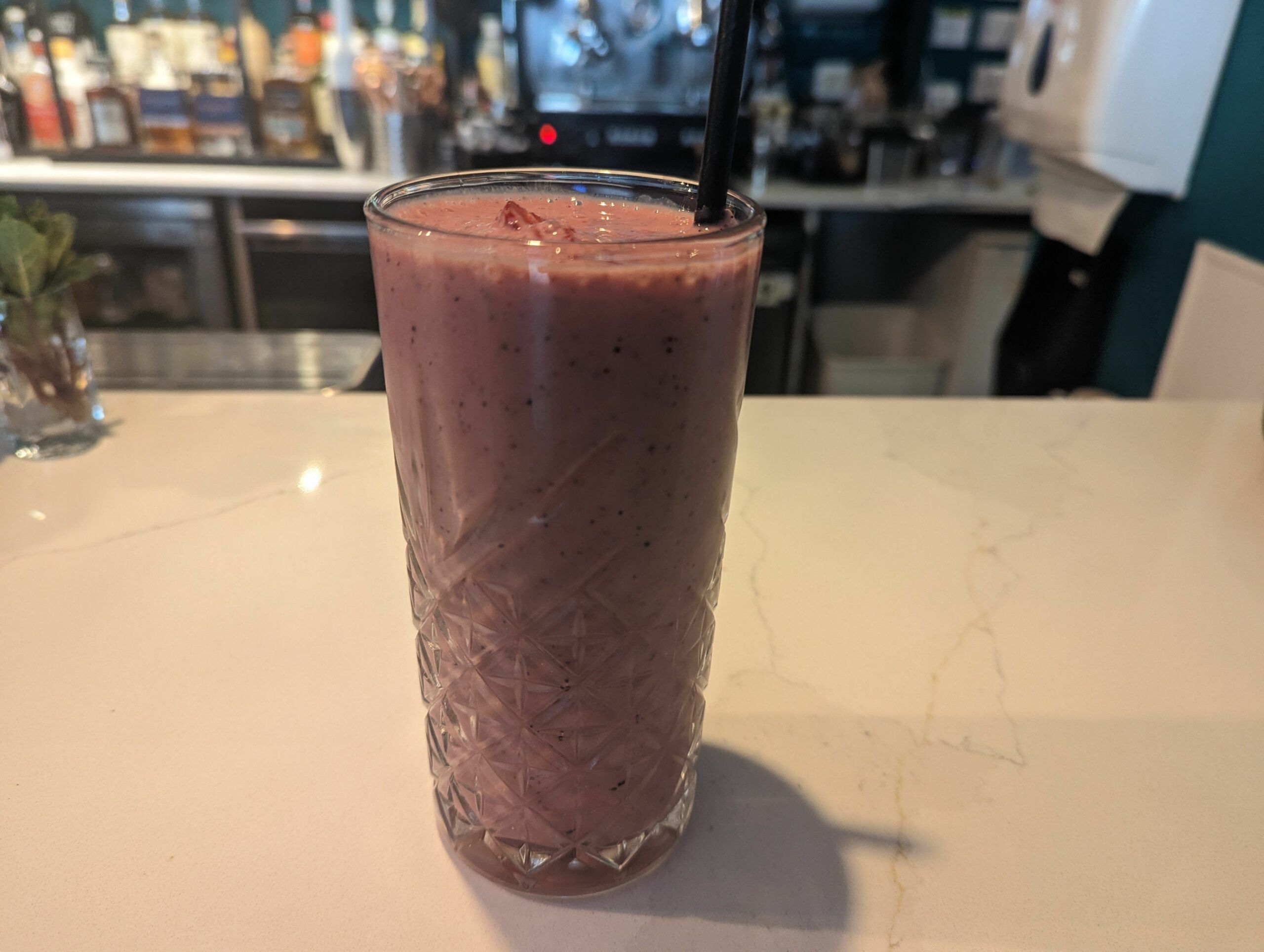 Bright pink strawberry smoothie made with fresh fruit. Brunch seven dials