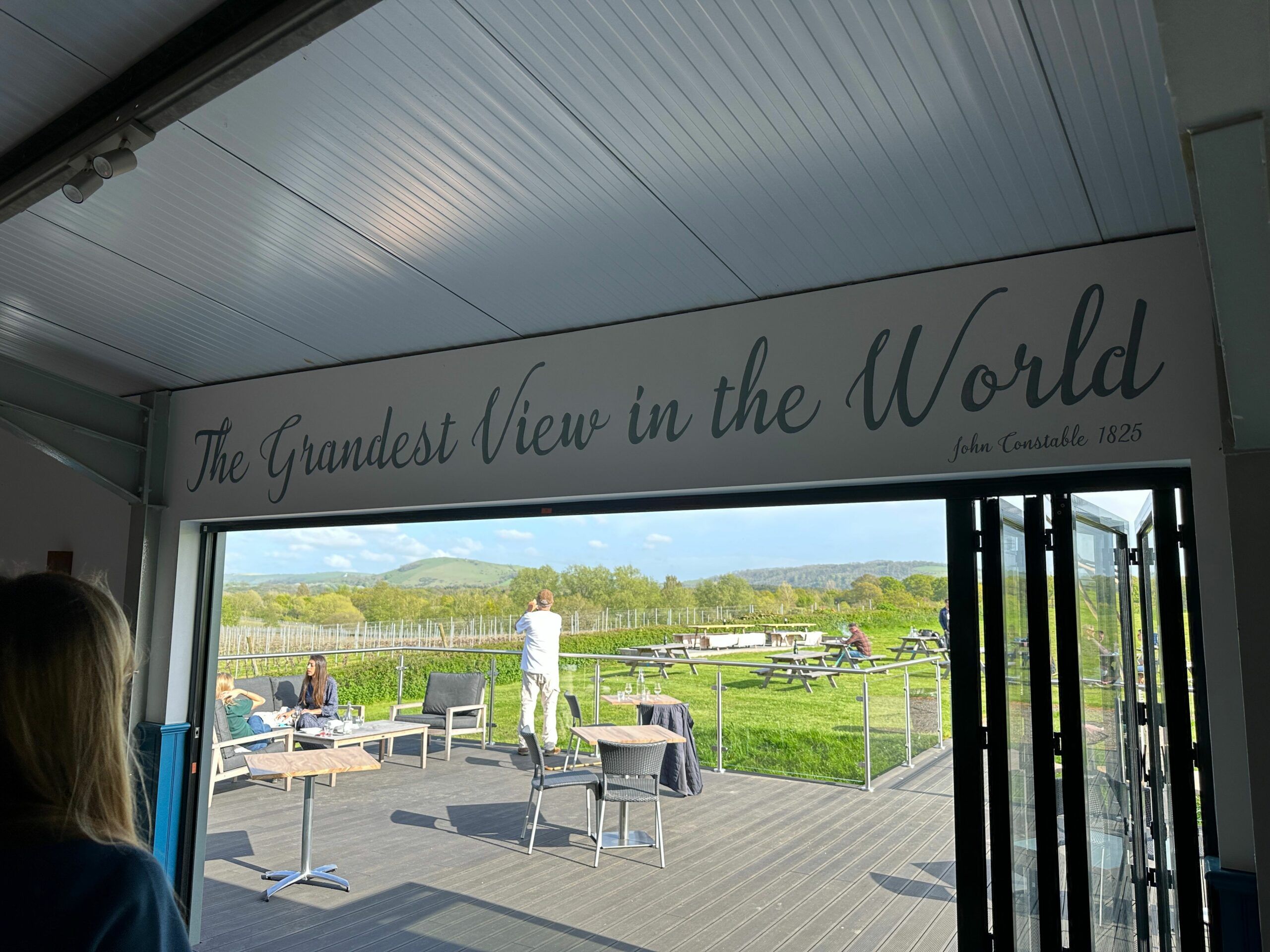 grandest view In the world sign on the terrace at Albourne Wine Estate. Supper Club