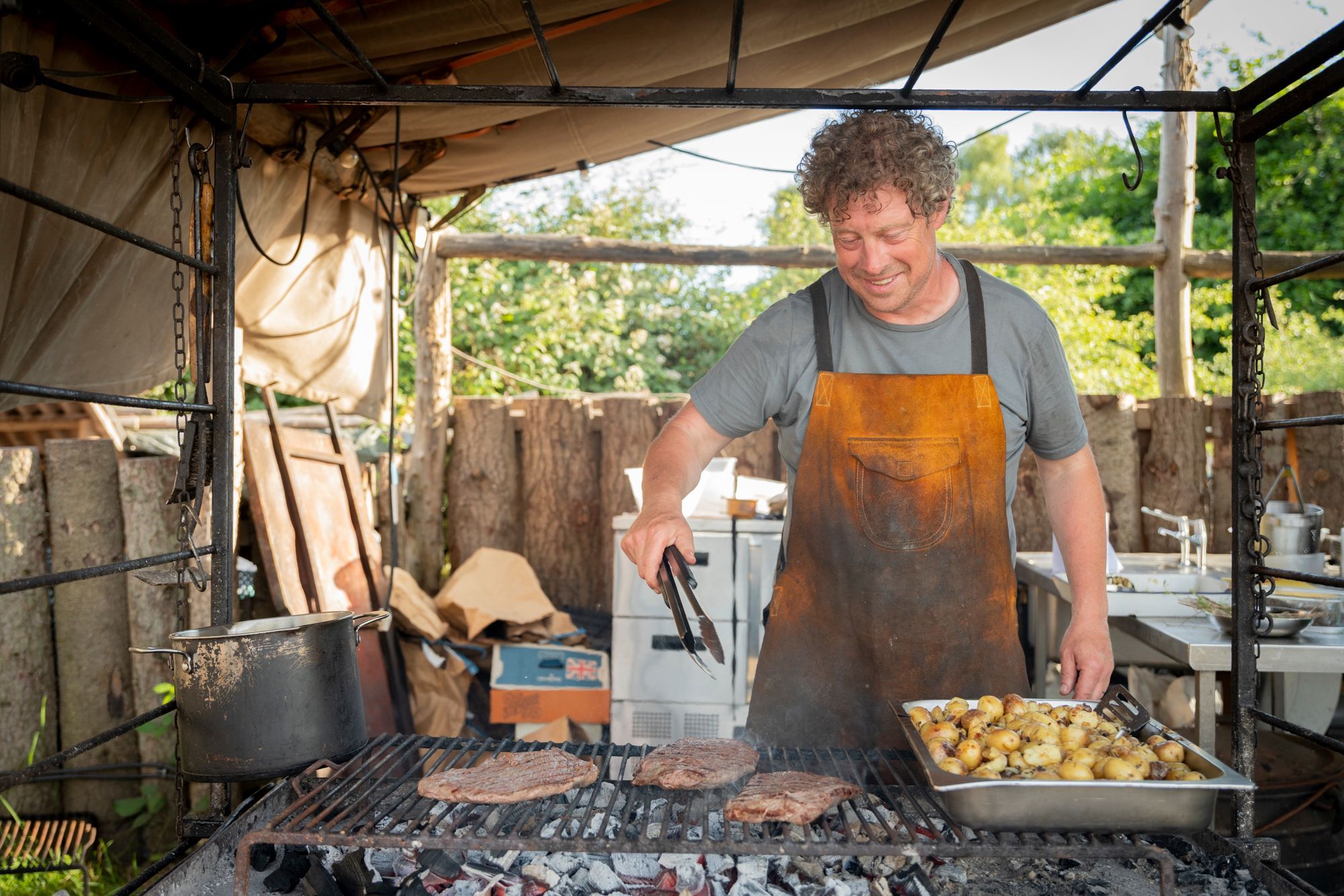 Mark Griff making BBQ meat at Woodfire Camping