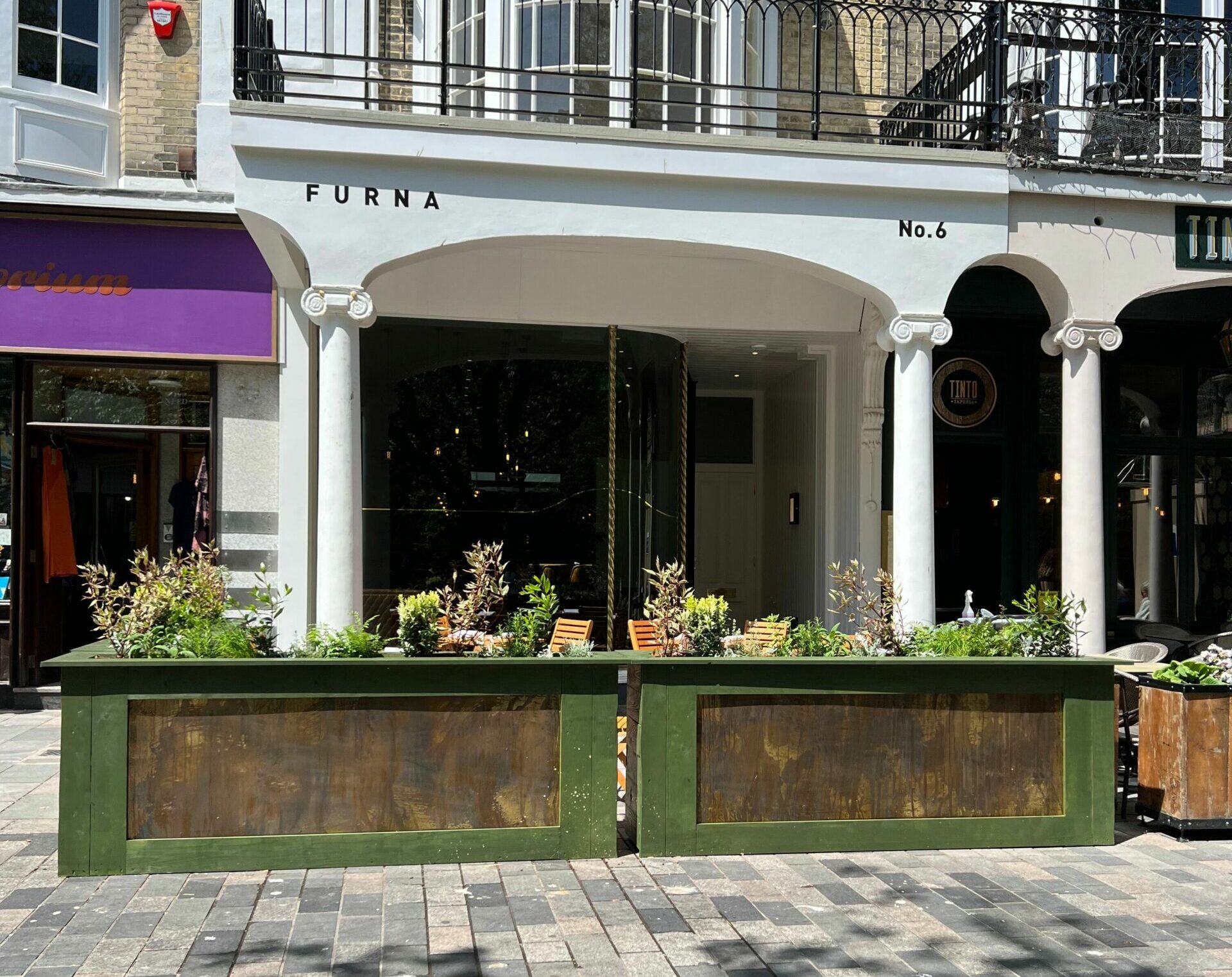 exterior shot of Furna on the pedestrianised street with outside seating.