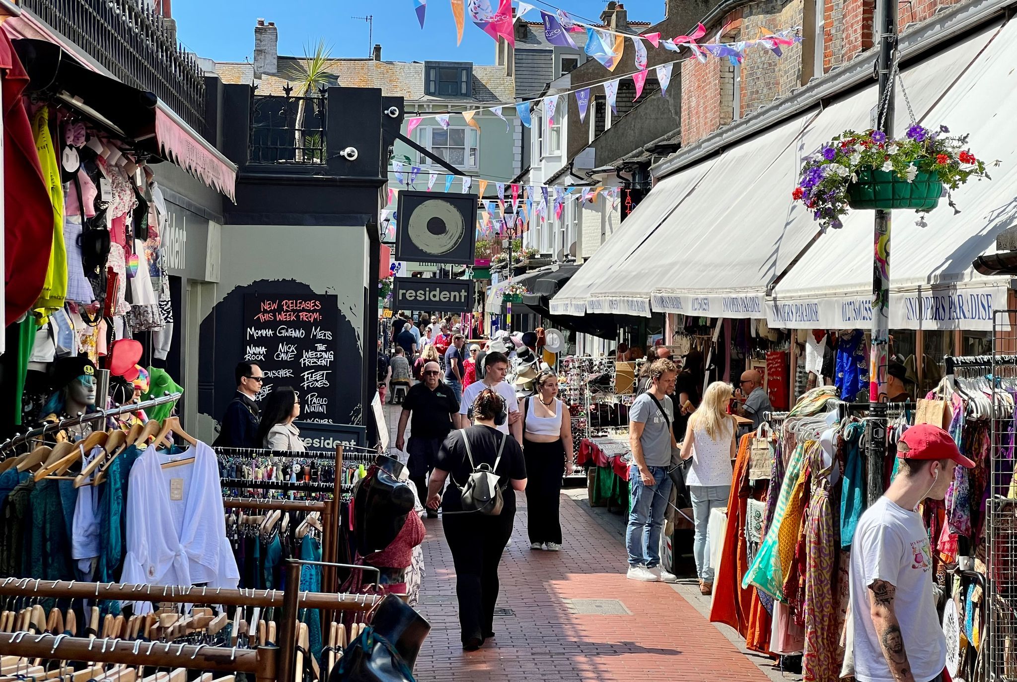 lovely shot of the North Laine, people walking on the street and looking at different shops. Brighton Holiday