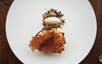 delicious looking dessert served on the white plate The Fig Tree
