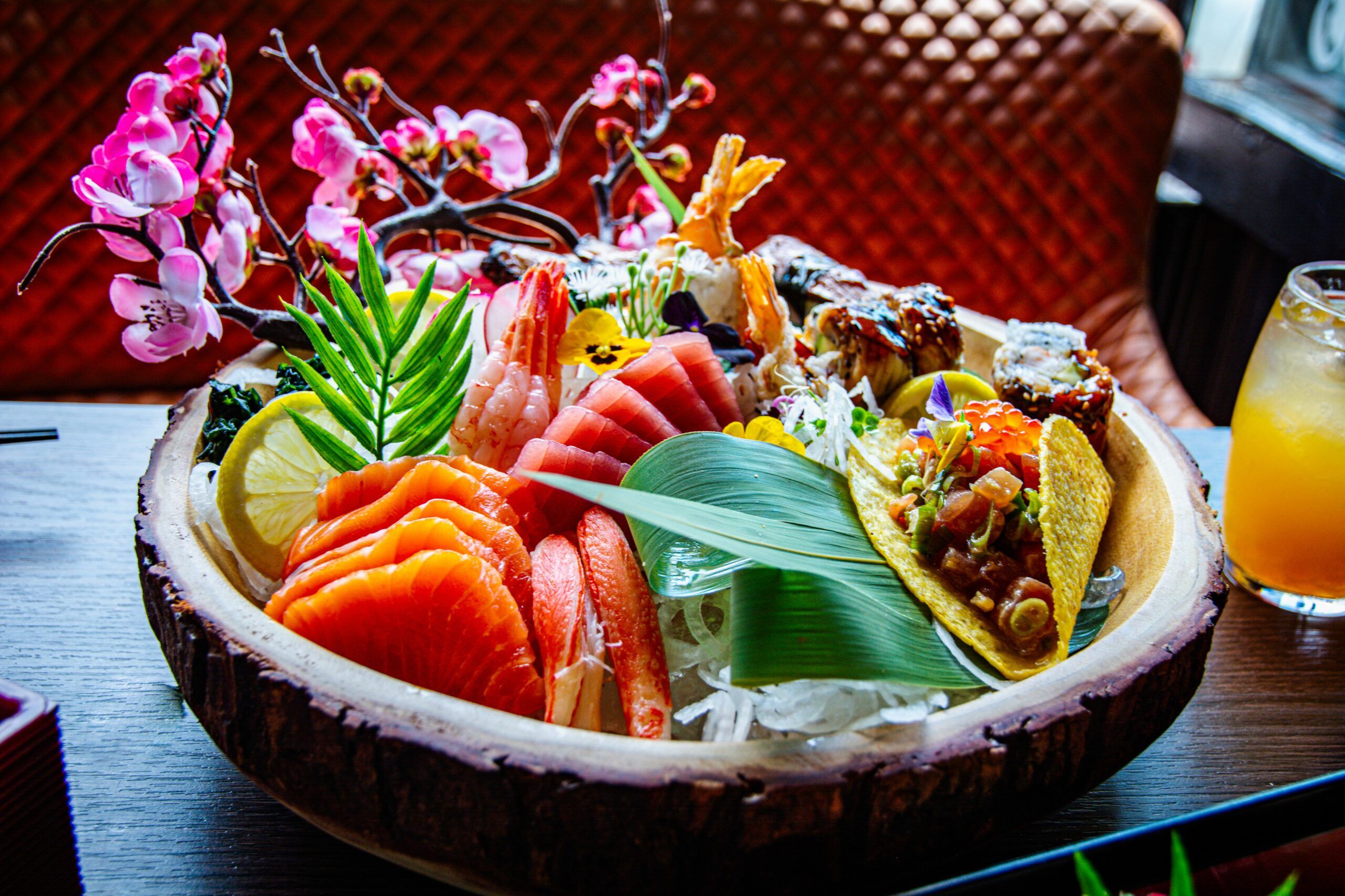 close up shot of the Japanese dish in the bowl. Salmon,prawn and tacos included.