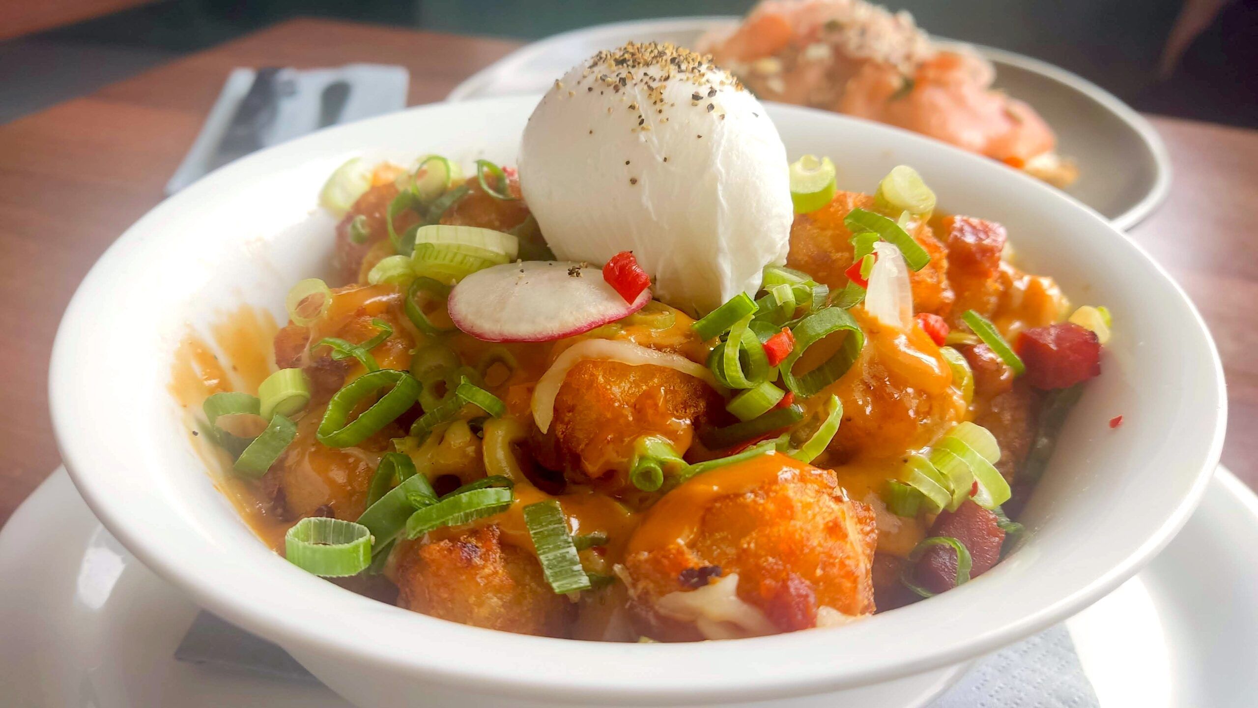 Brunch and cocktails at Baked Hove. Hash served in the white bowl 