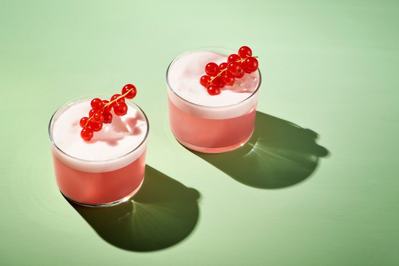 two red cocktails in small glasses