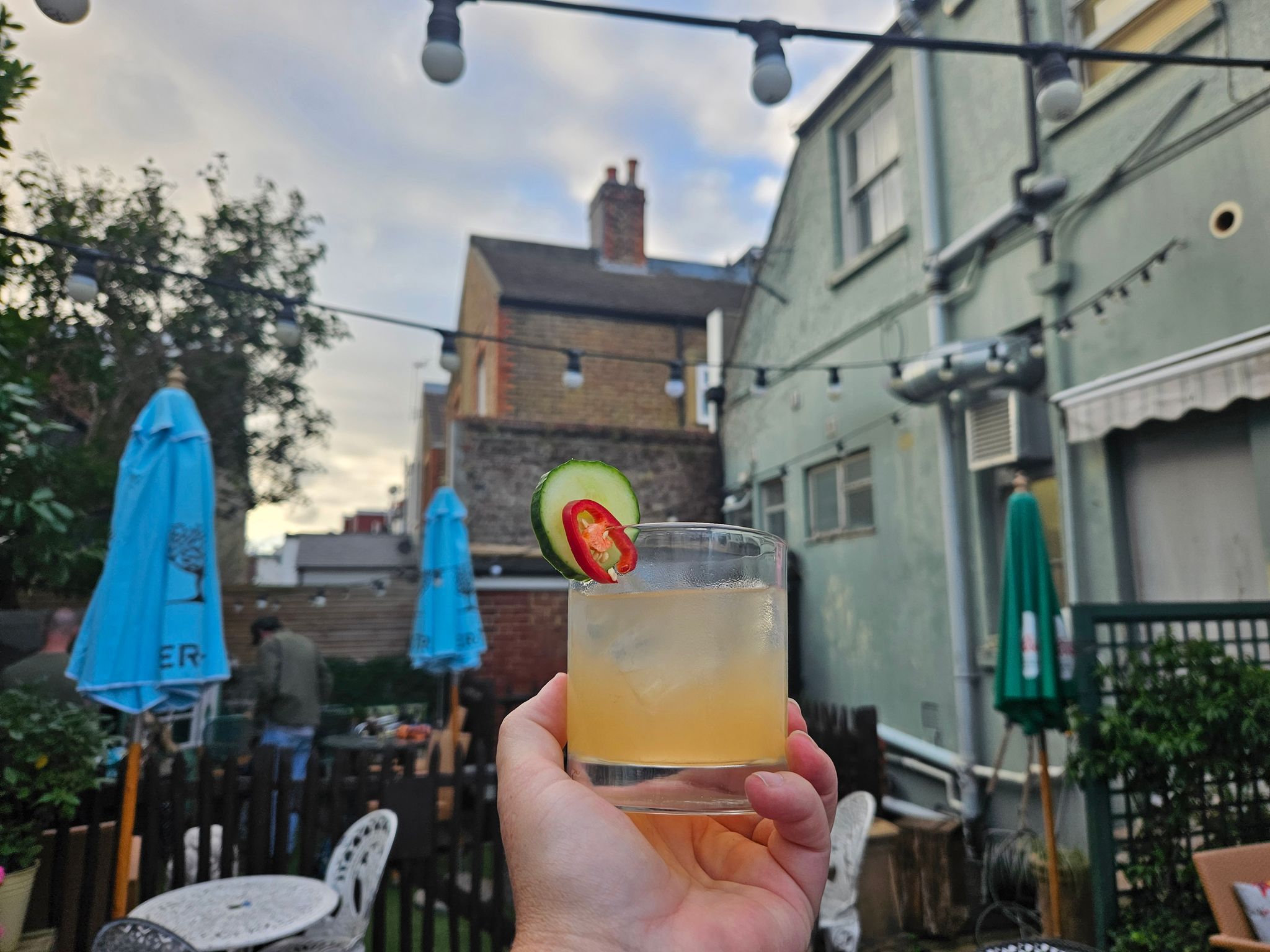 hand holding chilli cucumber margarita