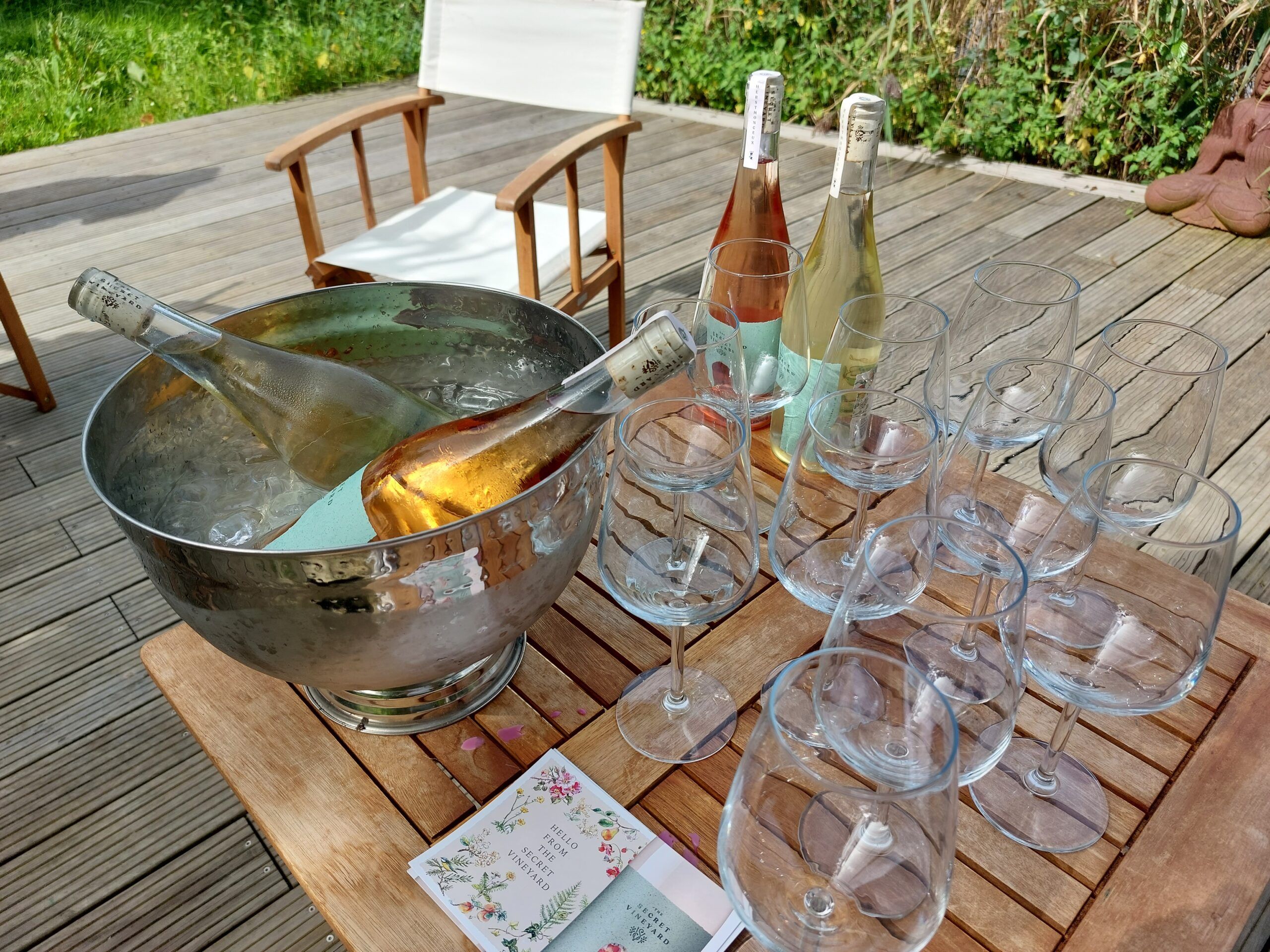 bottle of wines on the table and empty glasses