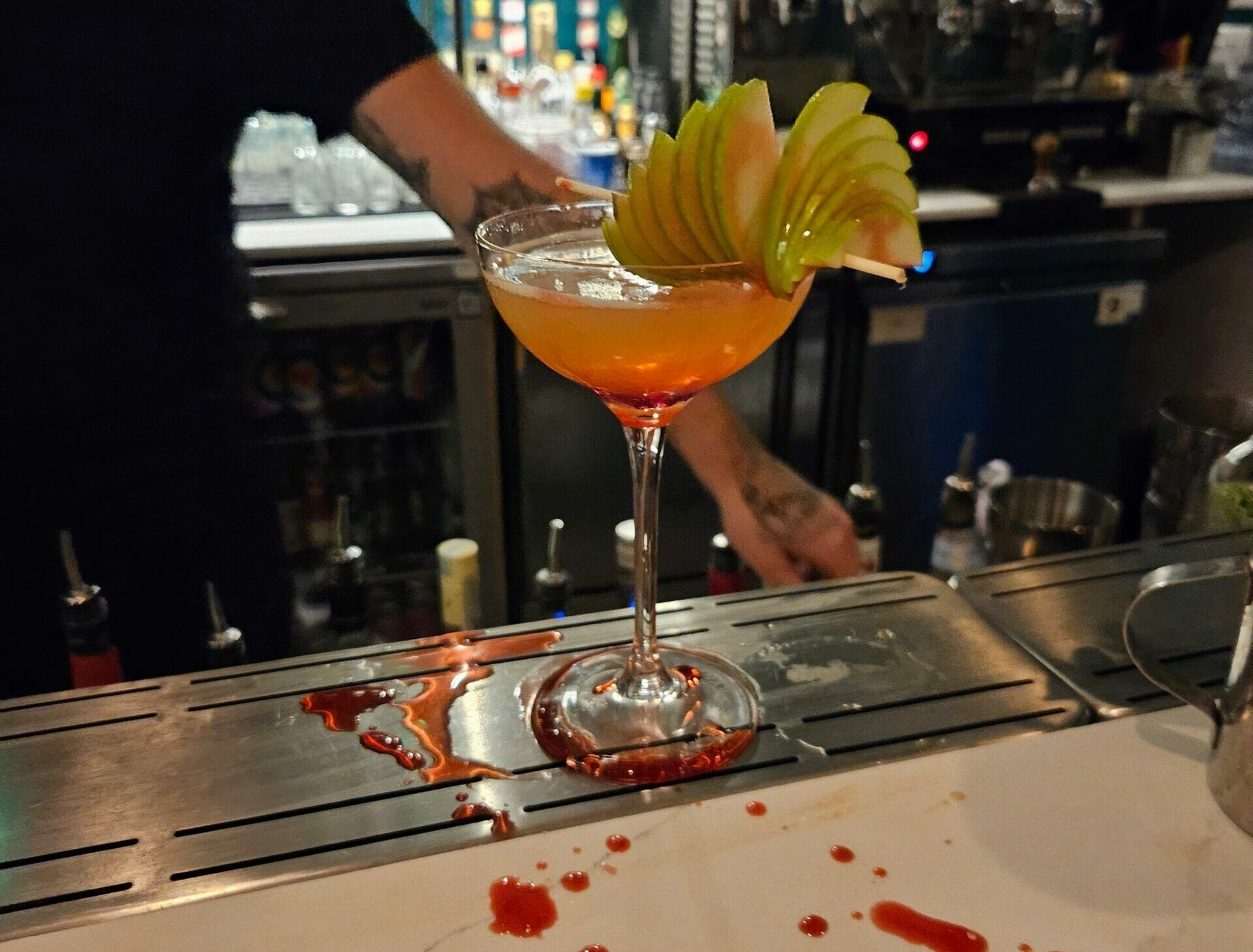Halloween themed apple cocktail. festive treats at brighten cocktail company