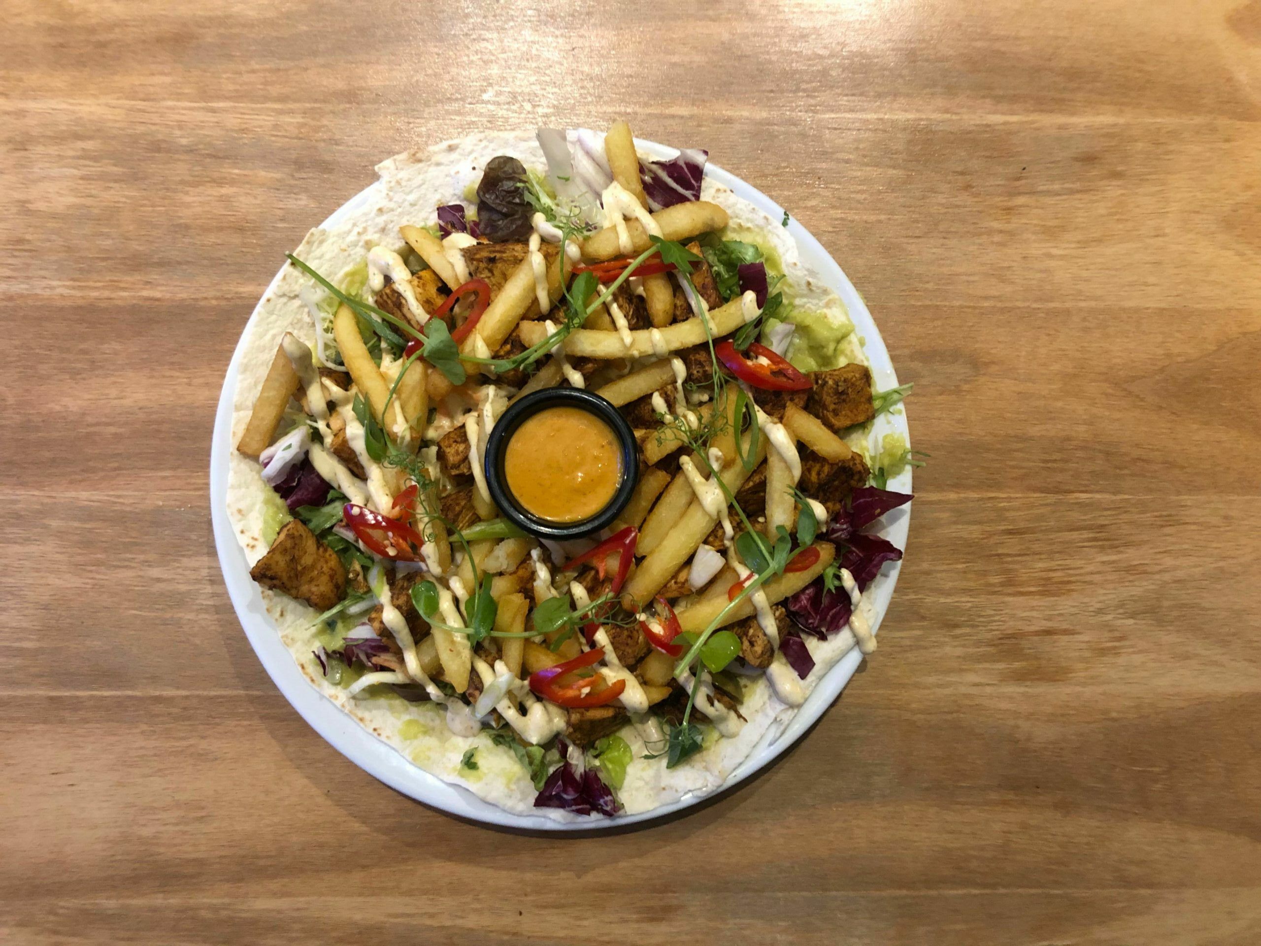 over head shot of the main dish at the gather Inn - The Jerked Chicken Open Kebab - Island cuisine